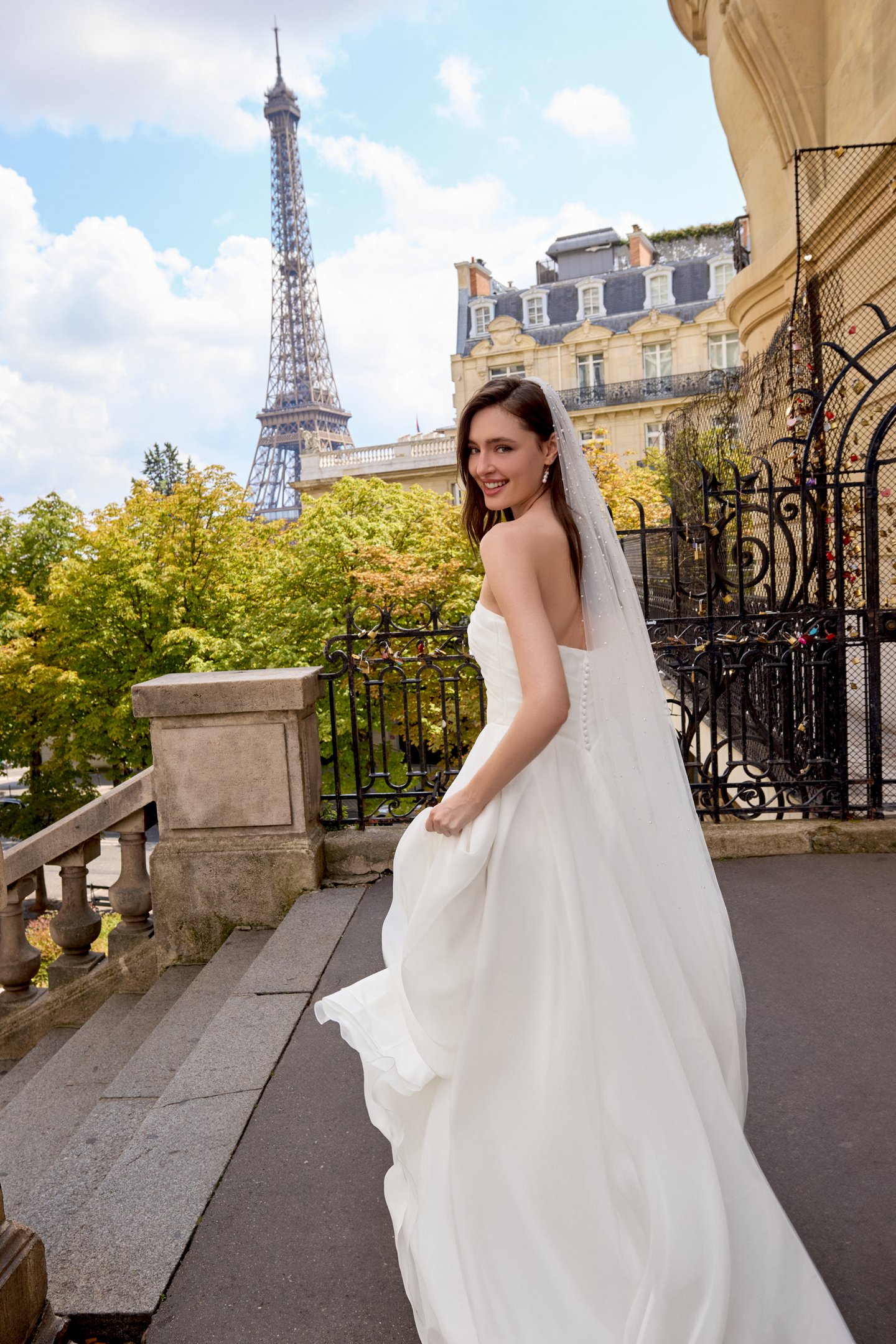 Adore by Justin Alexander Style 11431 Chloe Organza A-Line Gown with Asymmetrical Draped Bodice and Basque Waist