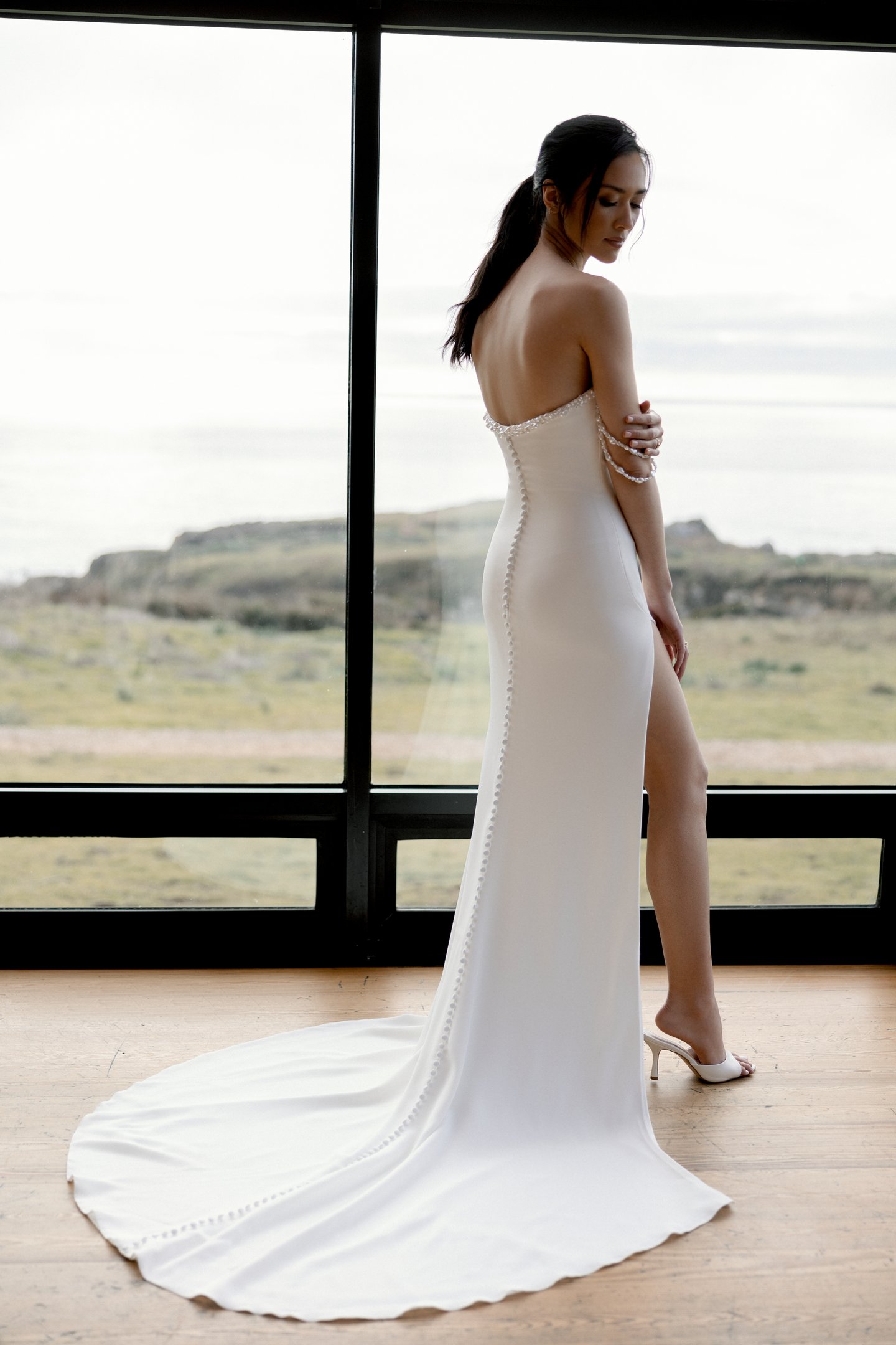 Adore by Justin Alexander Style 11405 Nixie Stretch Crepe Fit and Flare Gown with Freshwater Pearl-Trimmed Neckline and a Slit