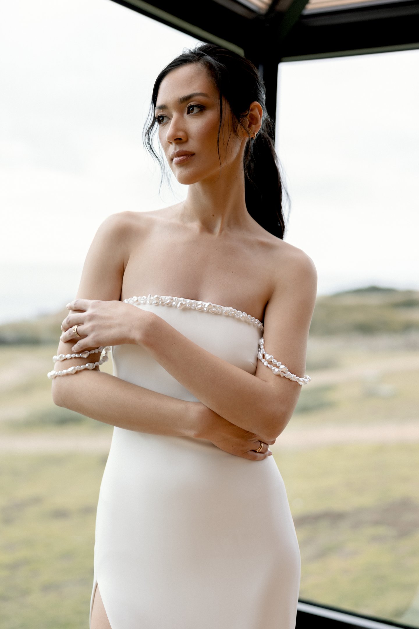 Adore by Justin Alexander Style 11405 Nixie Stretch Crepe Fit and Flare Gown with Freshwater Pearl-Trimmed Neckline and a Slit