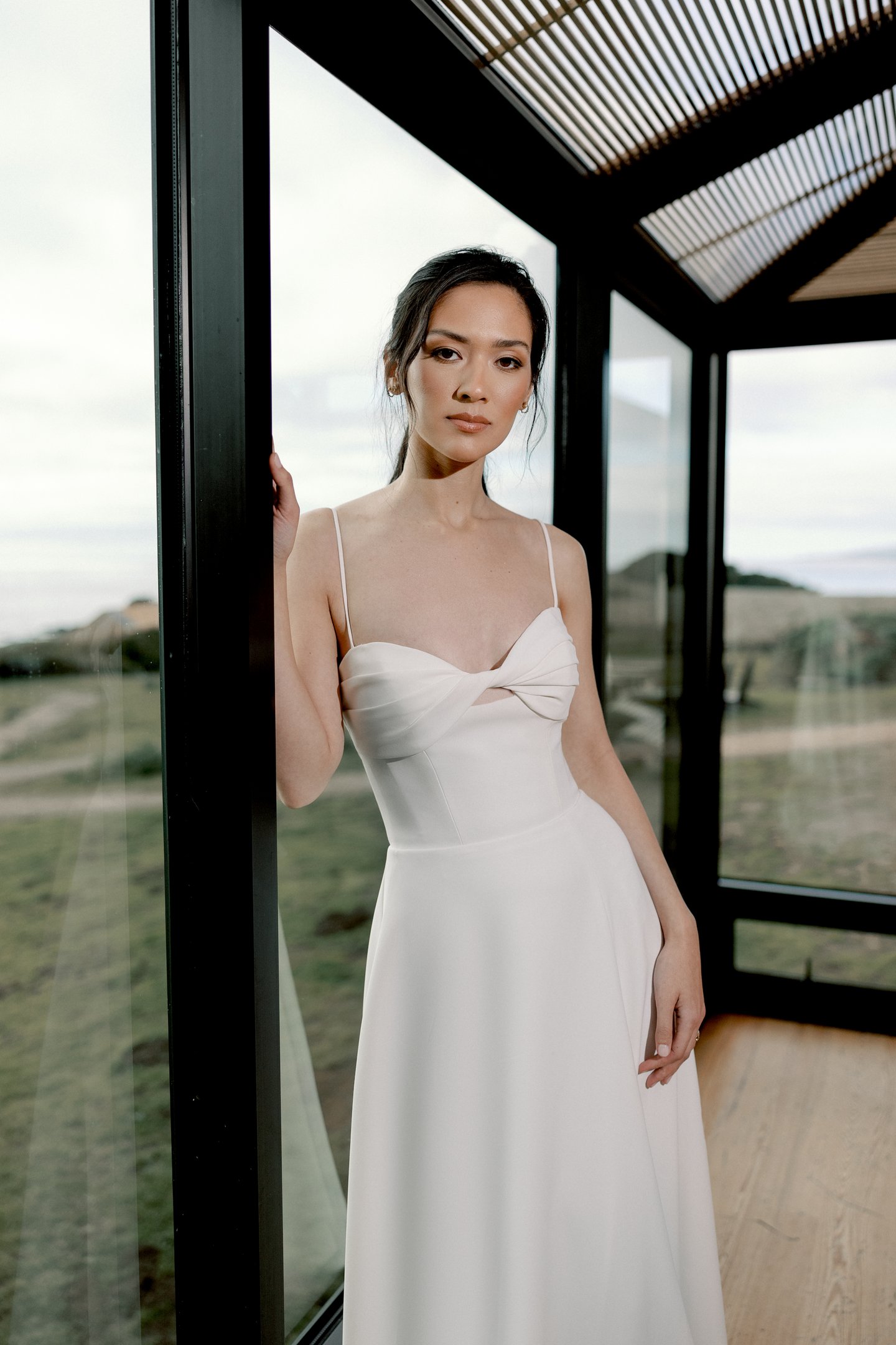 Adore by Justin Alexander Style 11413 Sereia Clean Crepe A-Line Gown with Twisted Bikini Neckline and Pockets Cut-Out Detail