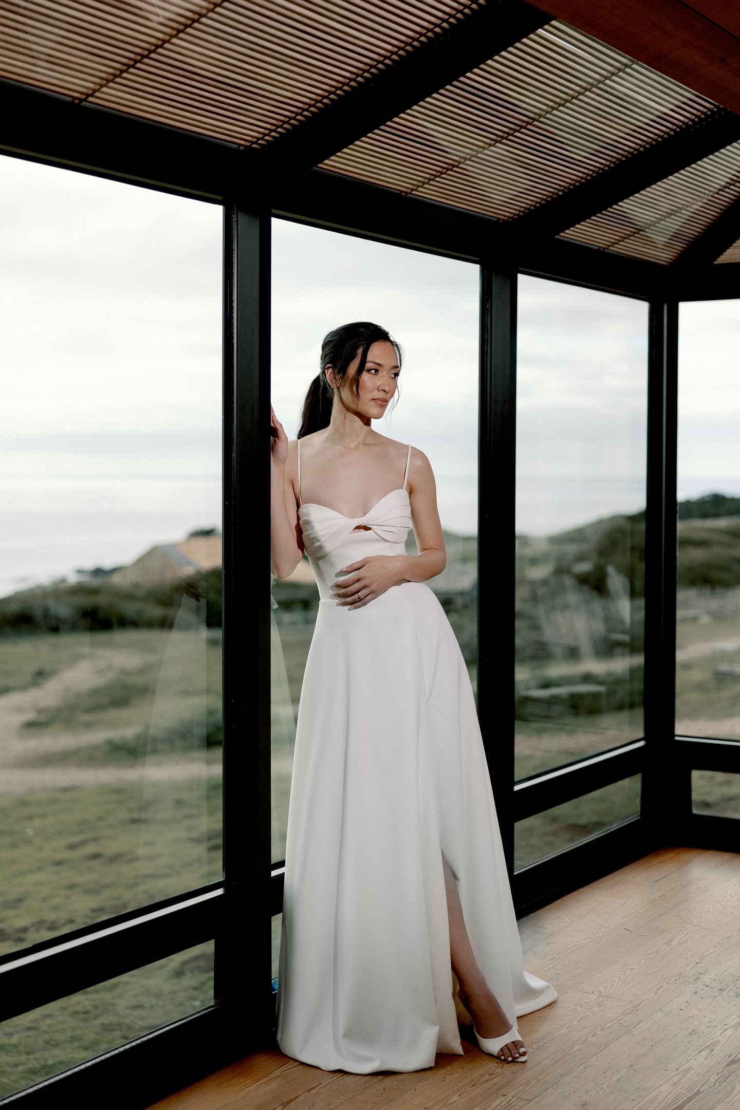 Adore by Justin Alexander Style 11413 Sereia Clean Crepe A-Line Gown with Twisted Bikini Neckline and Pockets Cut-Out Detail