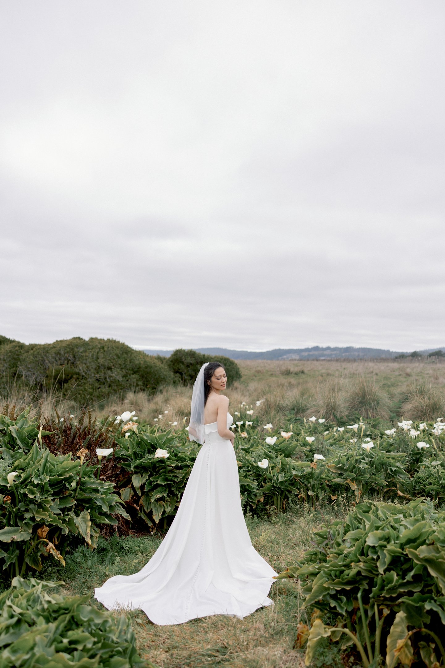 Adore by Justin Alexander Style 11419 Ondine Stretch Crepe A-Line Gown with Scalloped Cuff Neckline and Skirt Slit