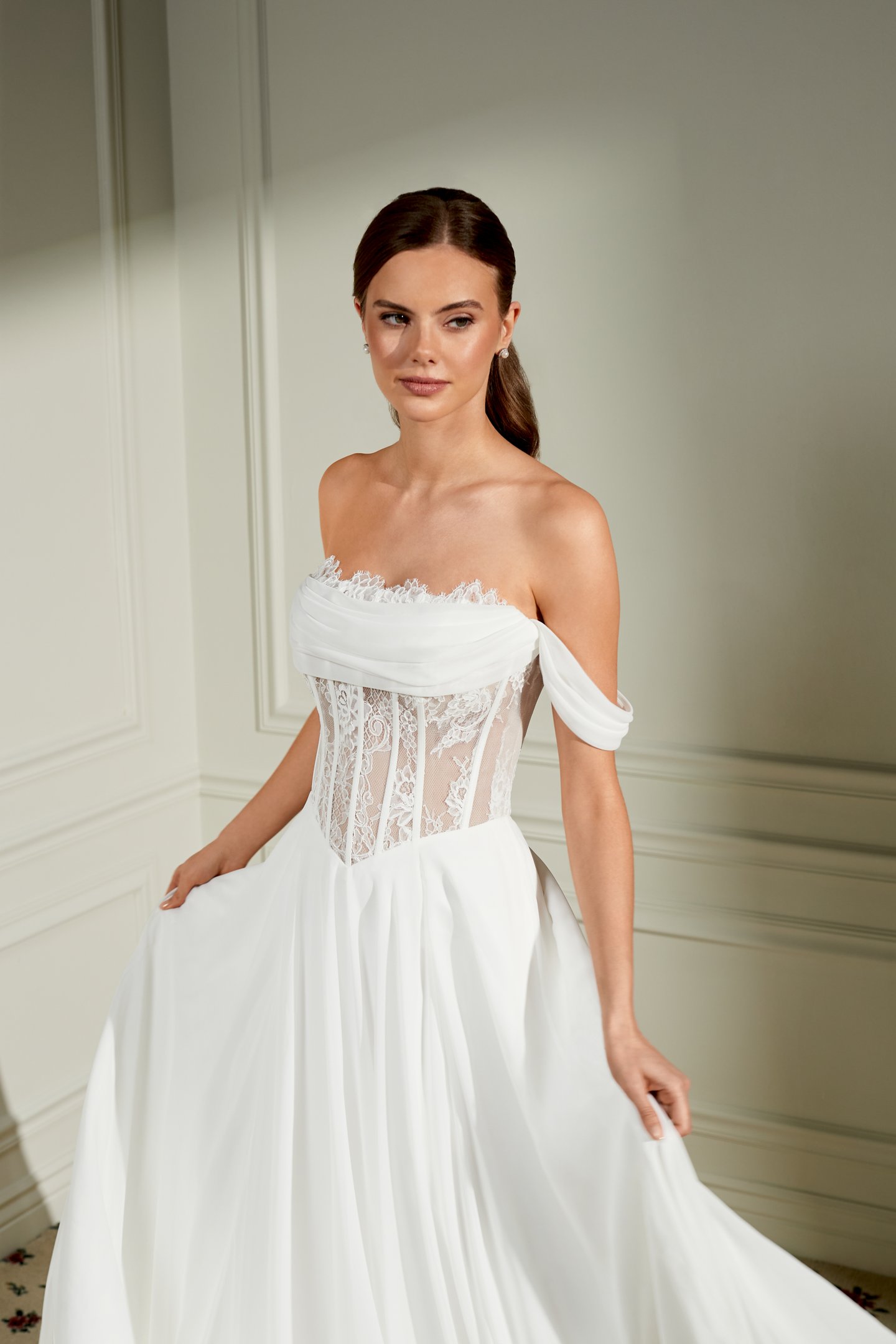 Adore by Justin Alexander Style 11460 Rosemary Chiffon A-Line Bridal Gown with Peek-A-Boo Lace at Strapless Cowl Neckline, Sheer Bodice, and Basque Waistline