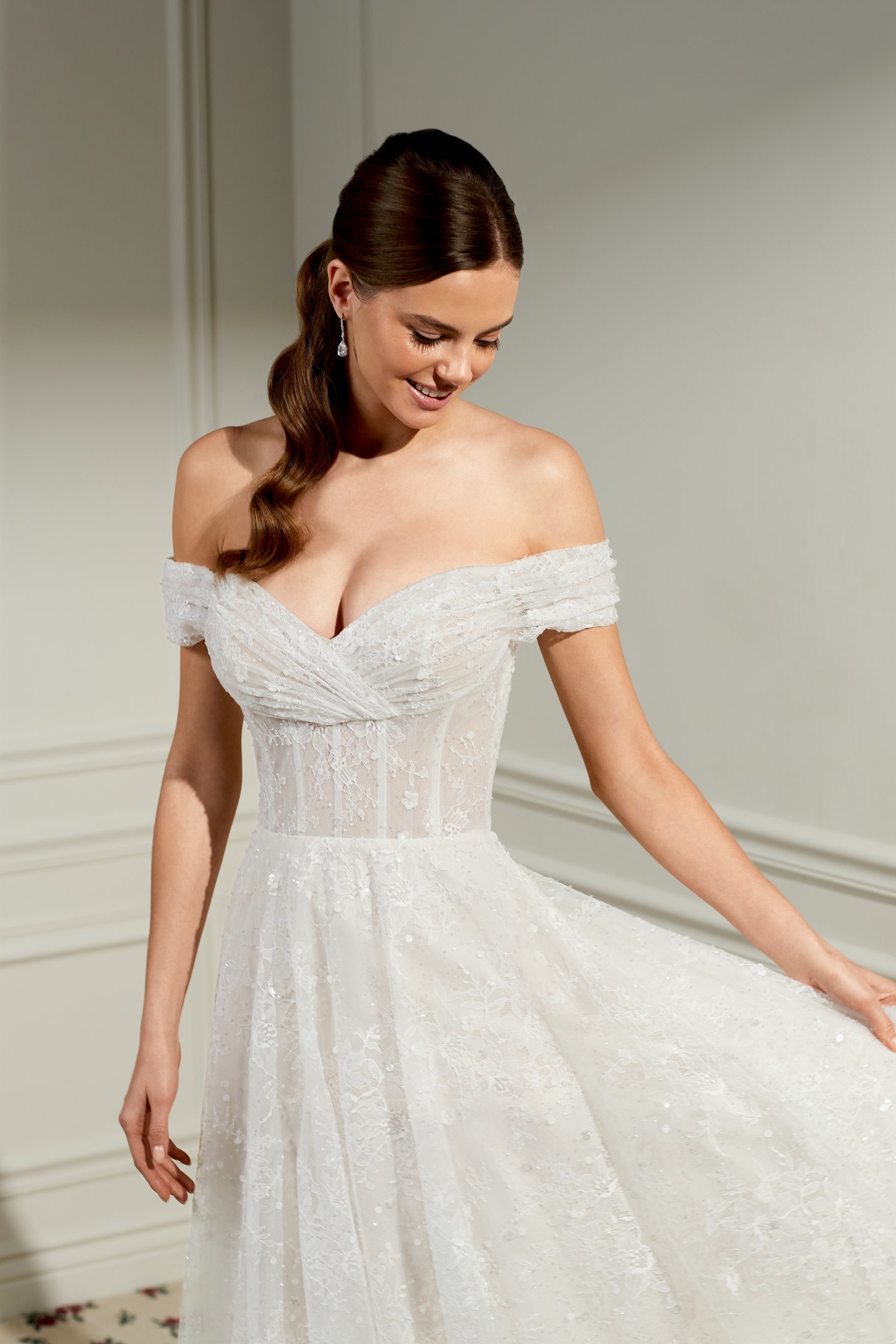 Adore by Justin Alexander Style 11479 Dollie Sparkling Chantilly Lace A-Line Bridal Gown withe Draped Off-the-Shoulder Neckline and Exposed Boning