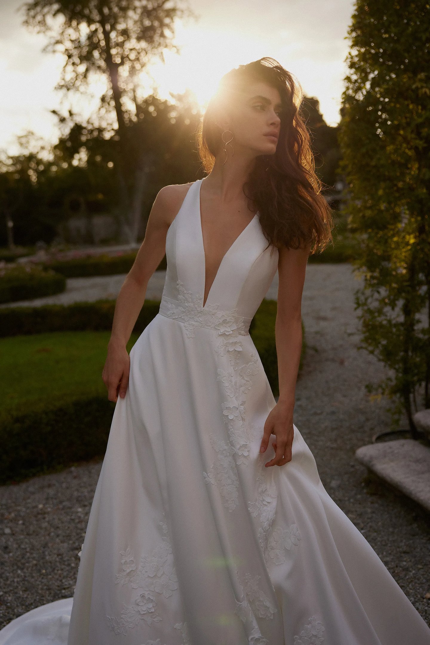a line plunging neckline wedding dress Sleeveless A-line wedding dress with a unique plunging neckline
