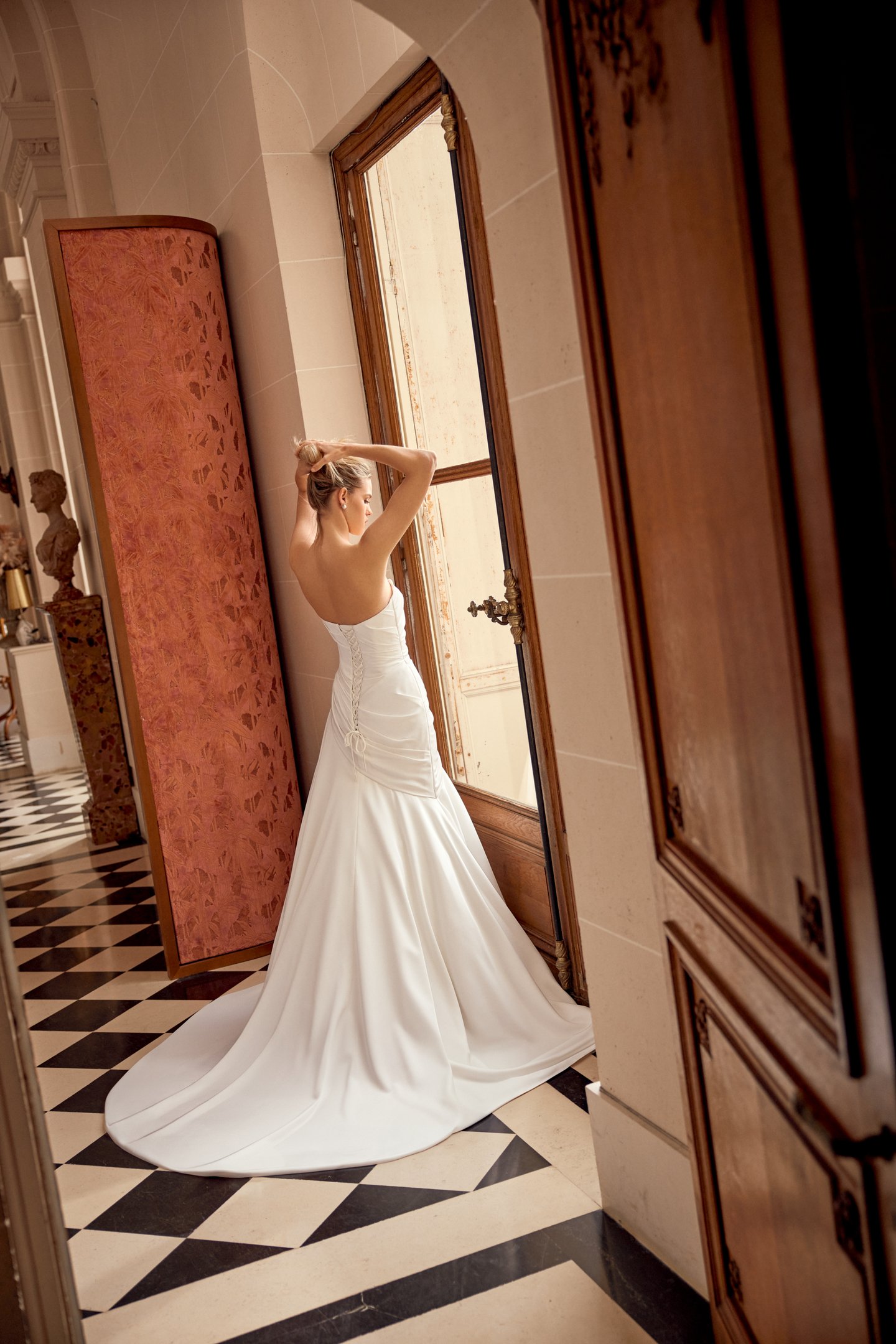 Justin Alexander Style 88541 Norelle Charmeuse A-Line Gown with Asymmetrical Draped Bodice and Waistline with Corset Back