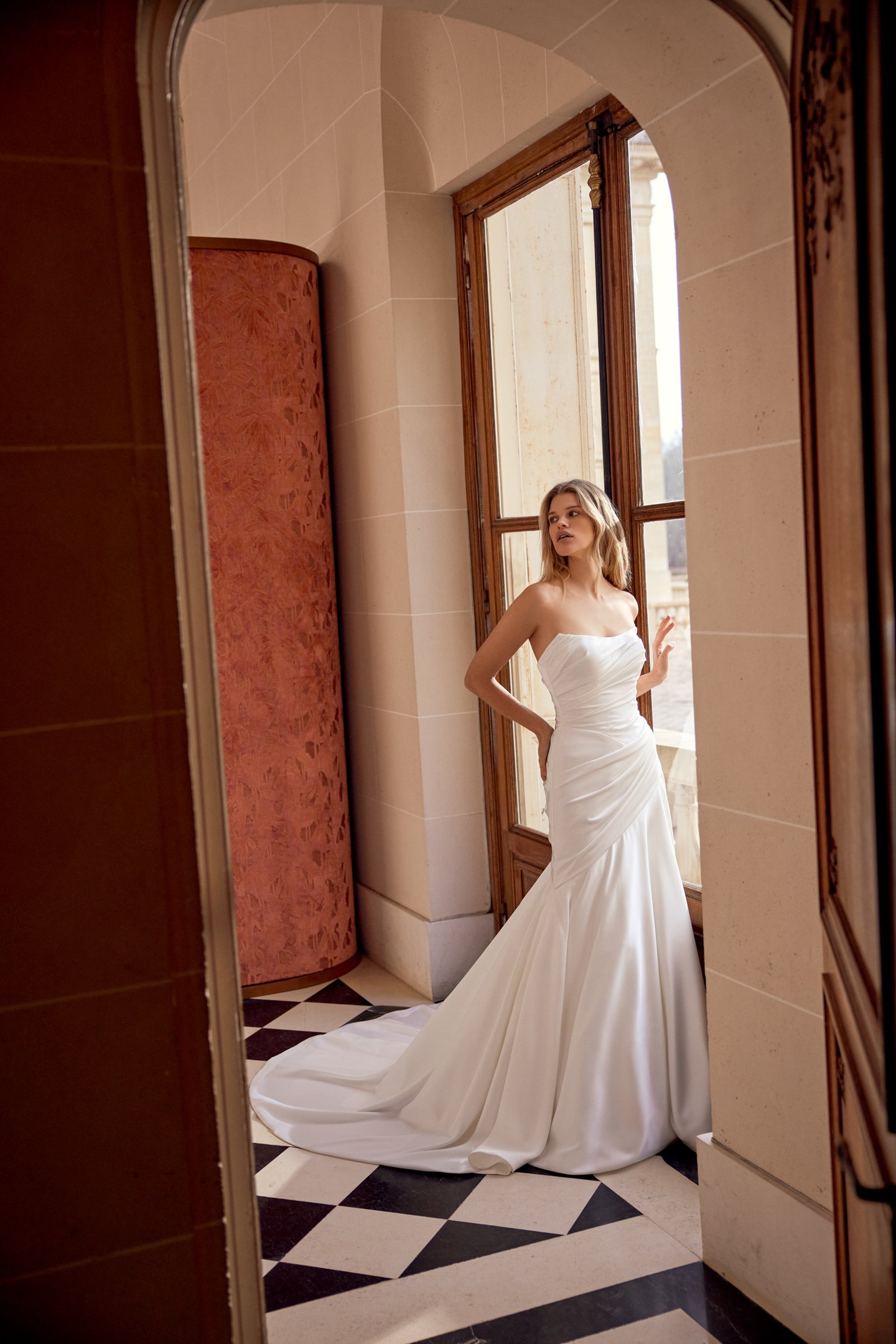 Justin Alexander Style 88541 Norelle Charmeuse A-Line Gown with Asymmetrical Draped Bodice and Waistline with Corset Back