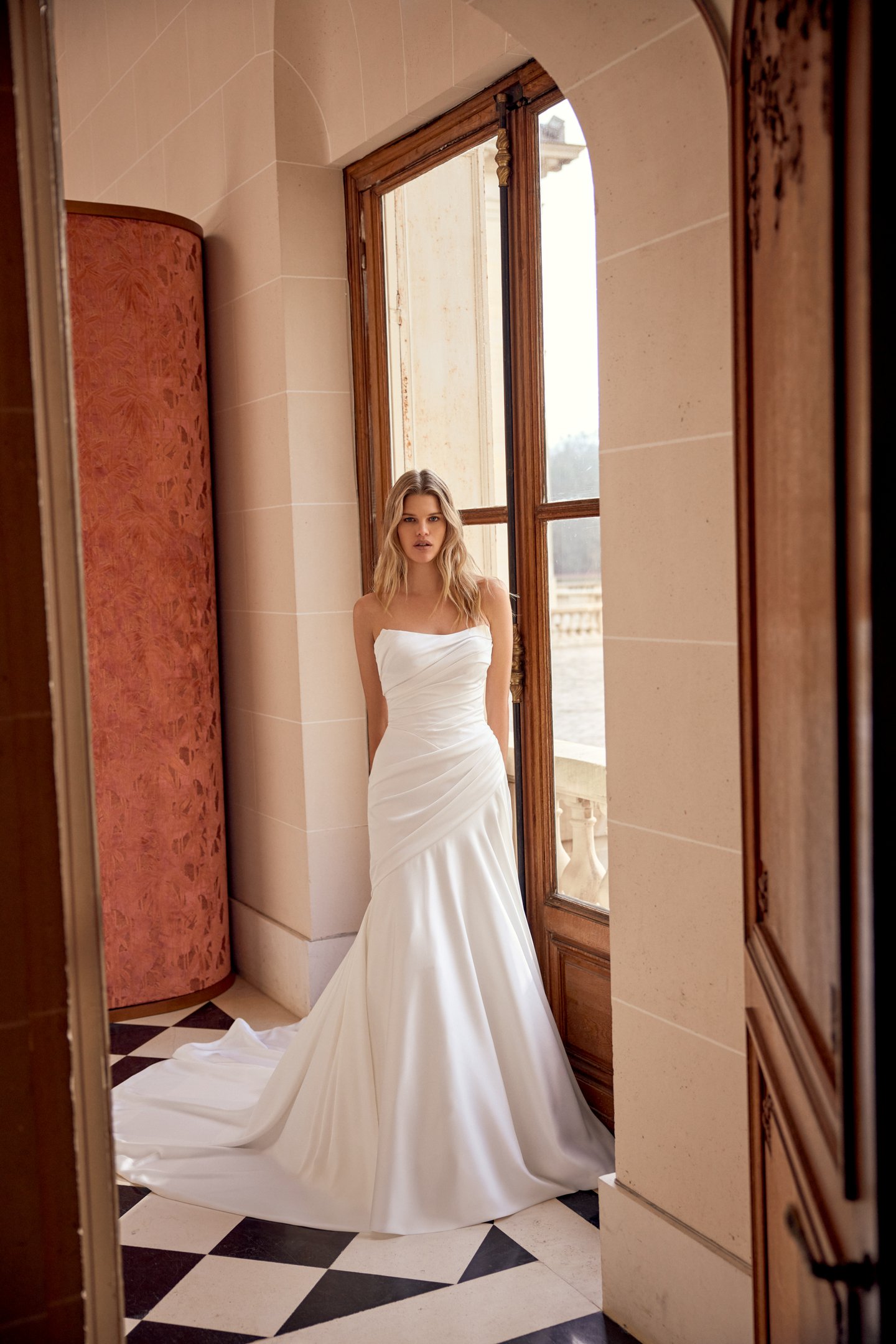 Justin Alexander Style 88541 Norelle Charmeuse A-Line Gown with Asymmetrical Draped Bodice and Waistline with Corset Back