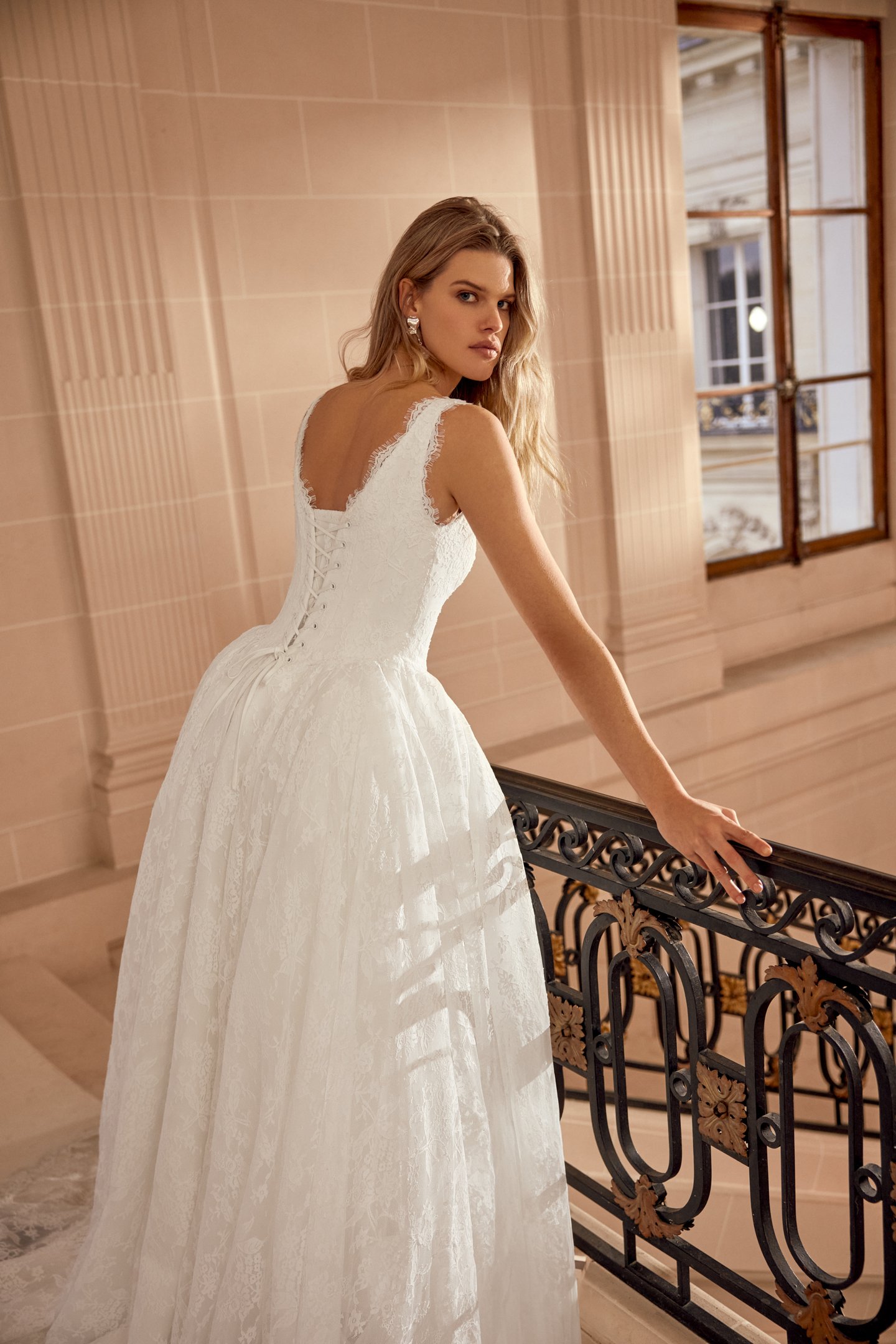 Justin Alexander Style 88543 Natalina Matte Allover Lace Ball Gown with V-Neckline and Dramatic Waterfall Waistline with Detachable Hip Puffs