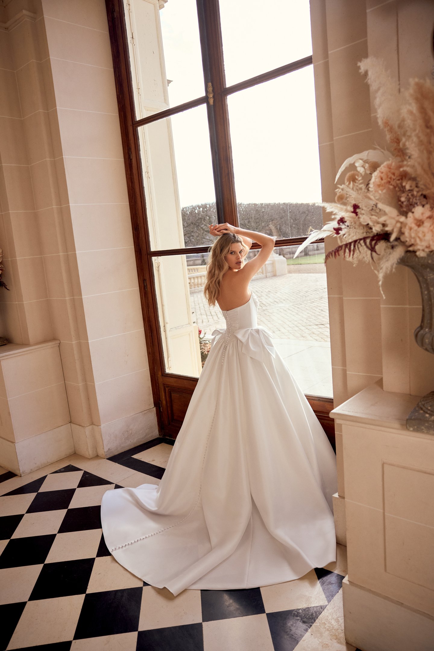 Justin Alexander Style 88545 Naomi Taffeta Ball Gown with Tightly Pleated Bodice and Gathered Skirt with Bow Accents