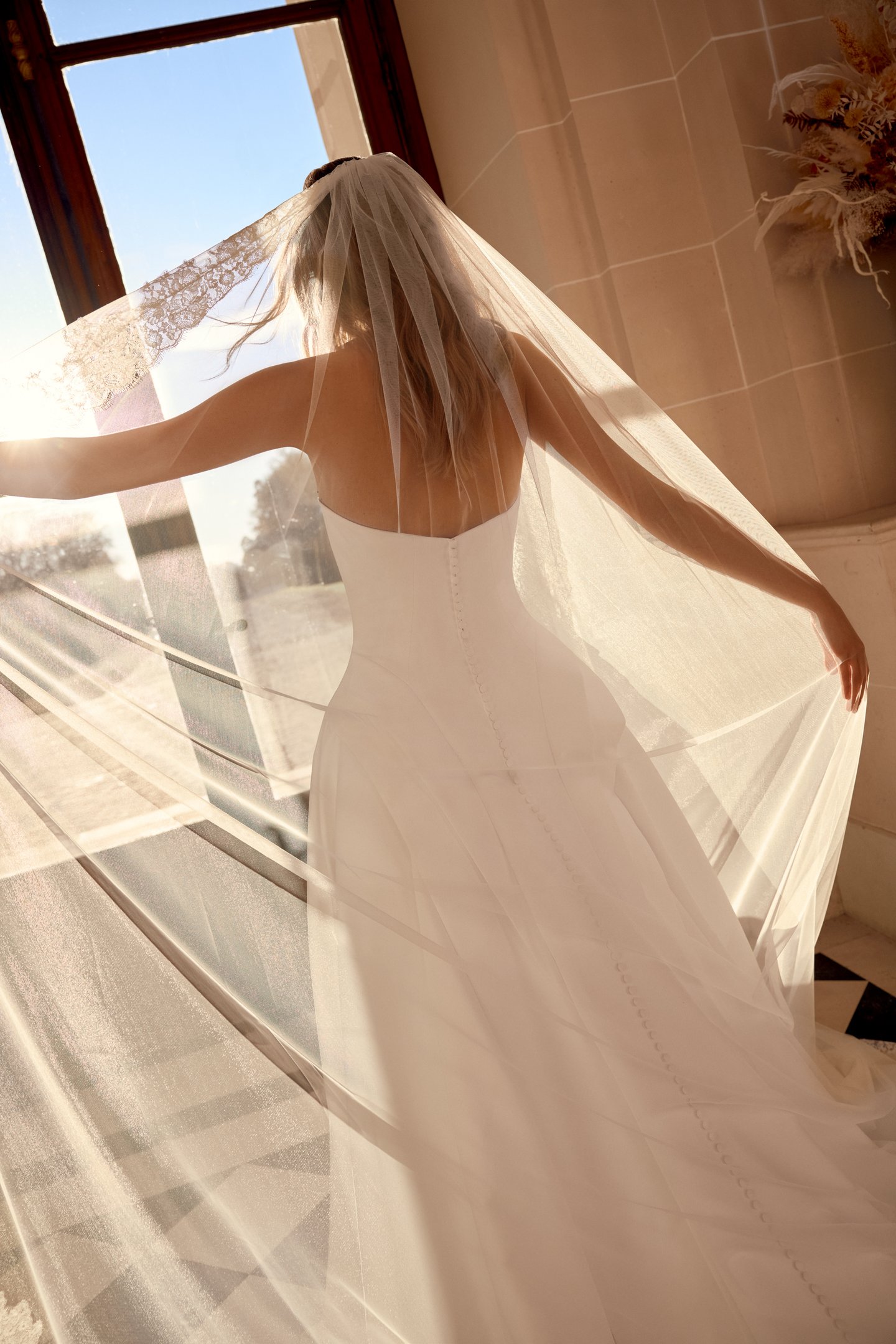 Justin Alexander Style 88546 Noble Satin A-Line Gown with Sculptural Waterfall Waistline and Tiered Peplum Details