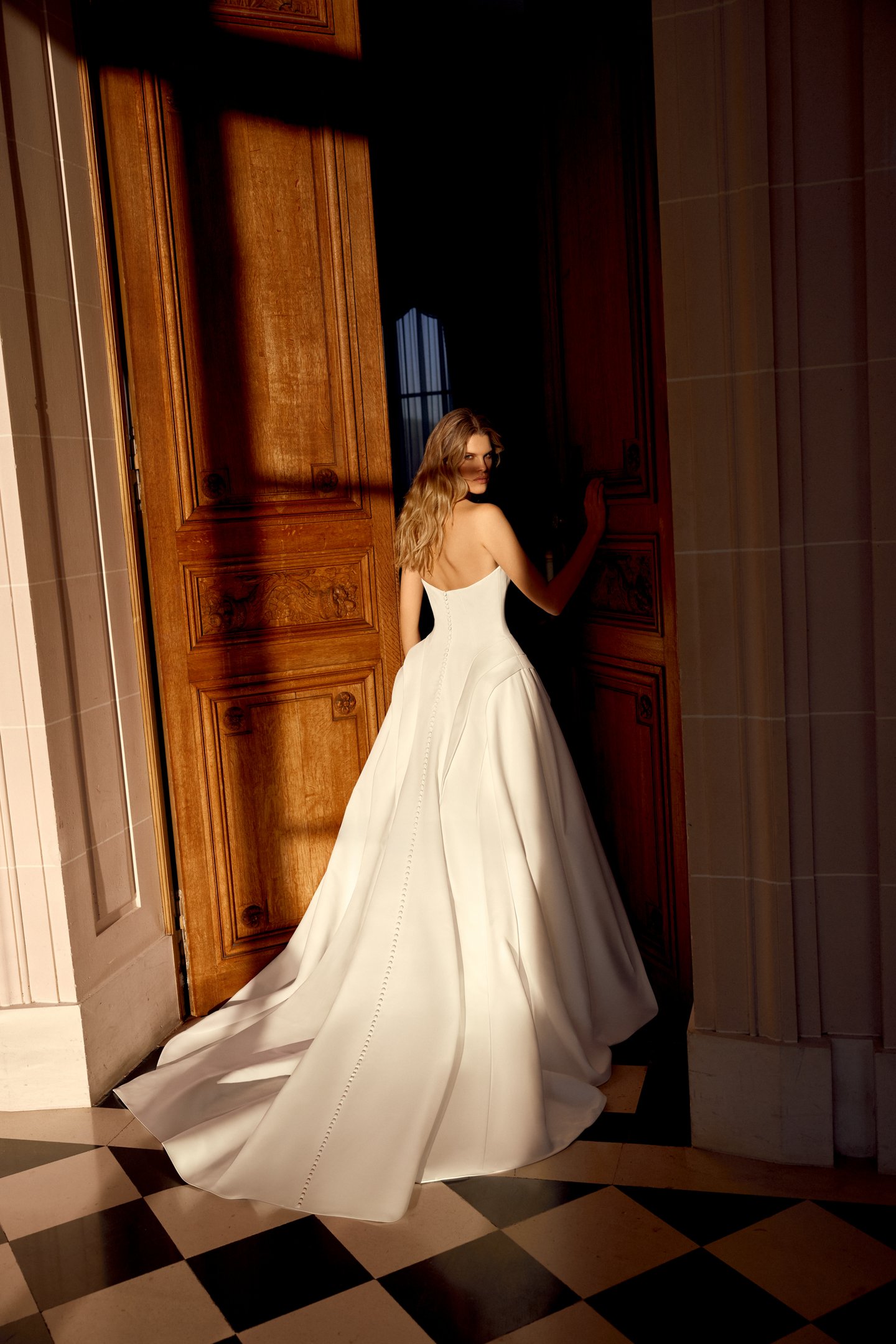 Justin Alexander Style 88546 Noble Satin A-Line Gown with Sculptural Waterfall Waistline and Tiered Peplum Details