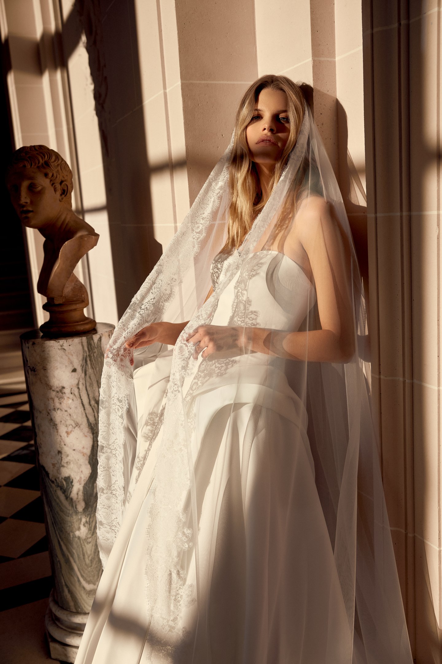 Justin Alexander Style 88546 Noble Satin A-Line Gown with Sculptural Waterfall Waistline and Tiered Peplum Details