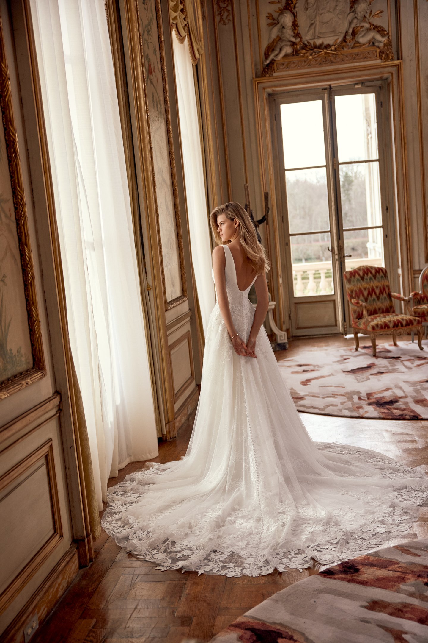 Justin Alexander Style 88549 Neve A-Line Gown with Sabrina Neckline, Crepe Bodice with Floral Lace Appliqués, and Chantilly Lace Skirt