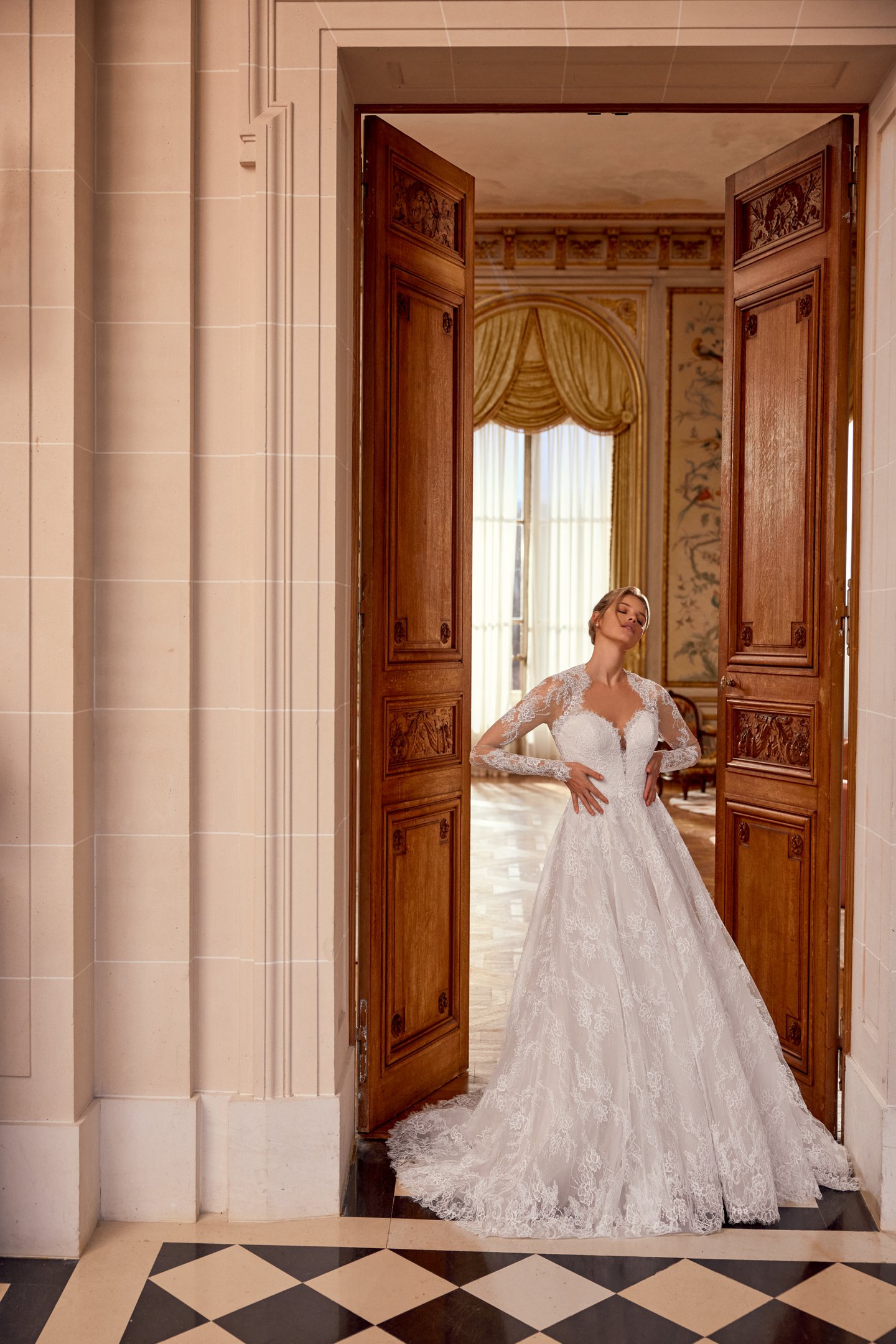 Justin Alexander Style 88557 Nela Allover Alençon Corded Lace A-Line Gown with Plunging Queen Anne Neckline and Illusion Keyhole Back