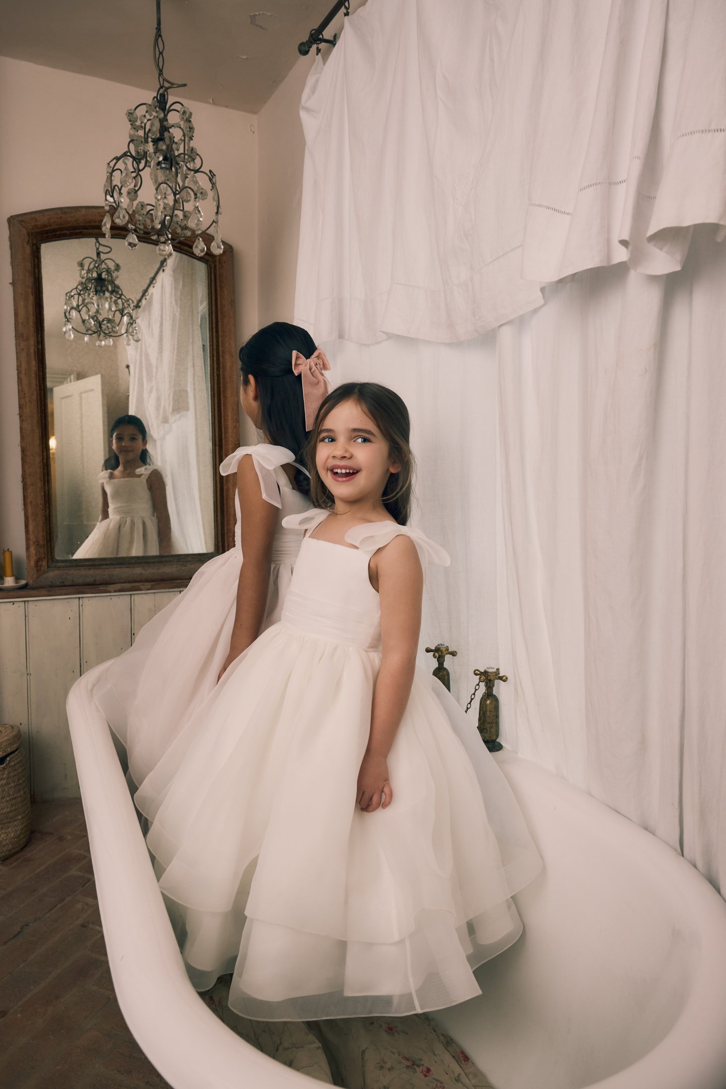 Fable by Justin Alexander Style FG002 Sadie Organza Tea Length Ball Gown with Delicate Organza Detachable Bows and Pleated Cummerbund