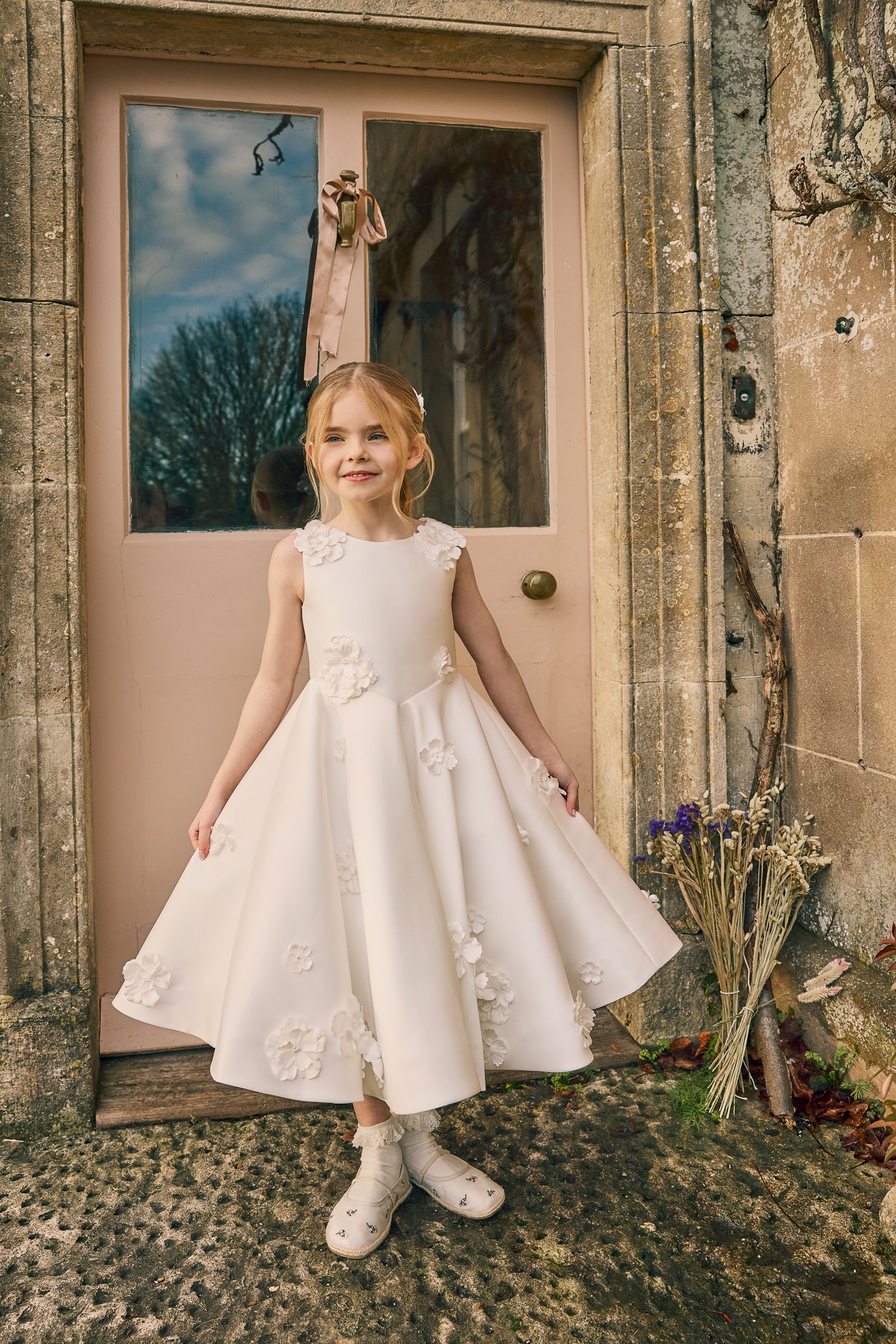 Fable by Justin Alexander Style FG012 Joni Satin Tea Length A-Line Sleeveless Dress with Floral Appliqués Scattered On Shoulder to Waist