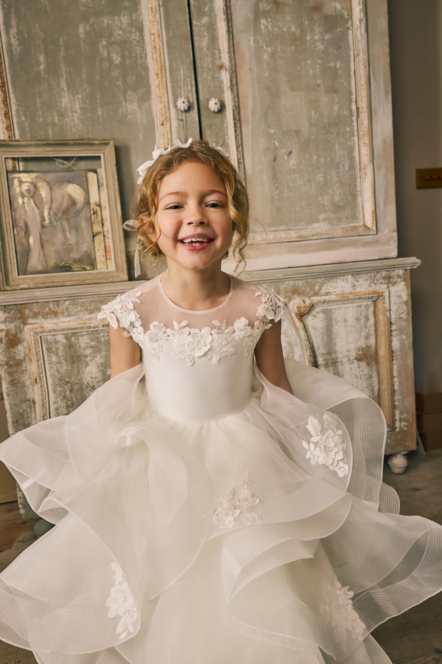 Fable by Justin Alexander Style FG015 Norah Organza Tea Length Ball Gown with Illusion Neckline, Floral Lace Appliqués, and Ruffled Layered Skirt
