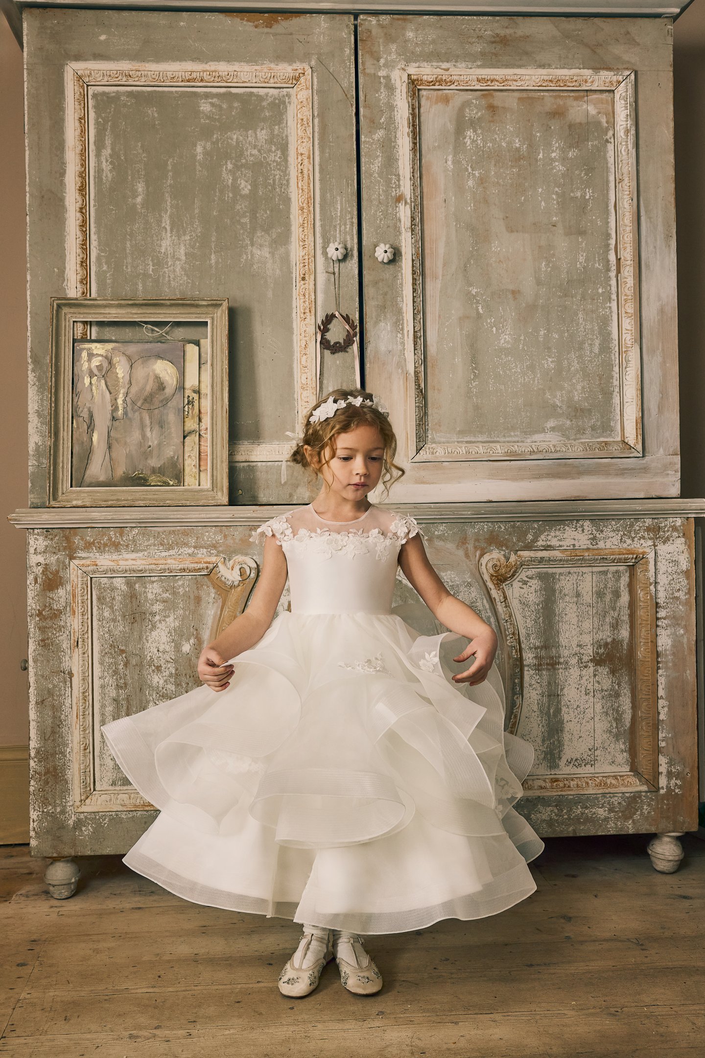 Fable by Justin Alexander Style FG015 Norah Organza Tea Length Ball Gown with Illusion Neckline, Floral Lace Appliqués, and Ruffled Layered Skirt