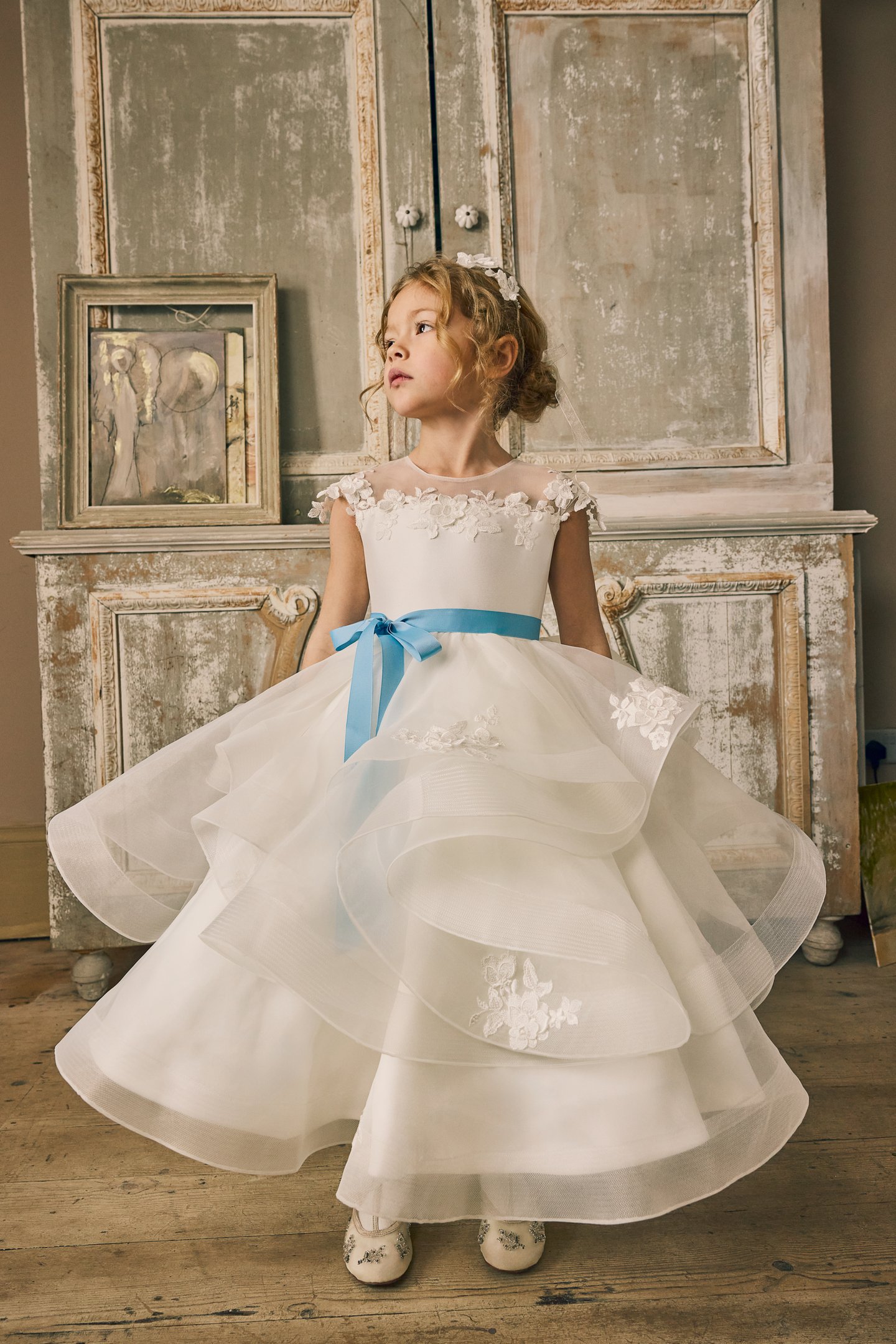 Fable by Justin Alexander Style FG015 Norah Organza Tea Length Ball Gown with Illusion Neckline, Floral Lace Appliqués, and Ruffled Layered Skirt