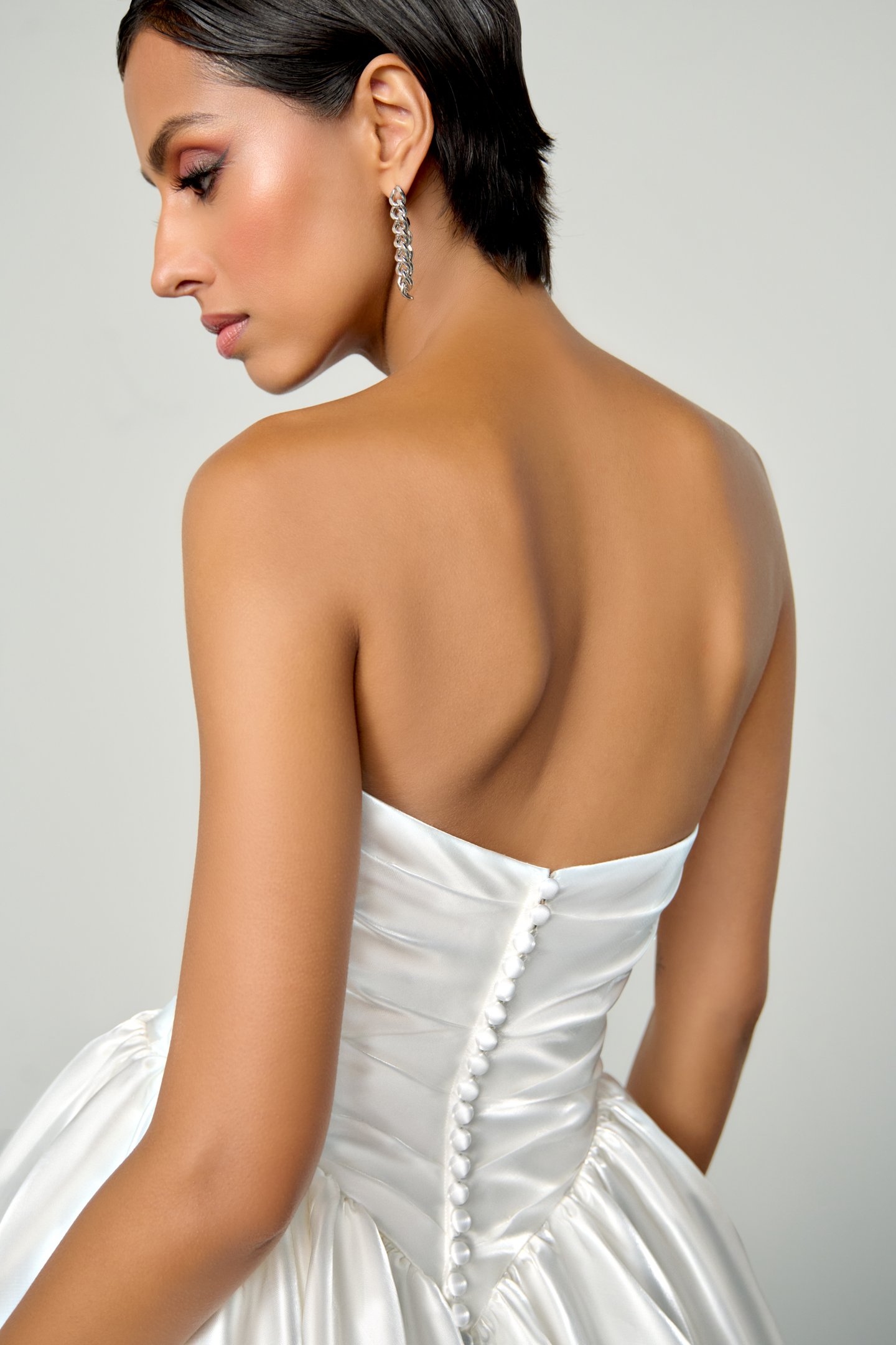 Justin Alexander Signature Style 99398 ECHO Liquid Satin Ball Gown with Crystal Peek-a-Boo Neckline