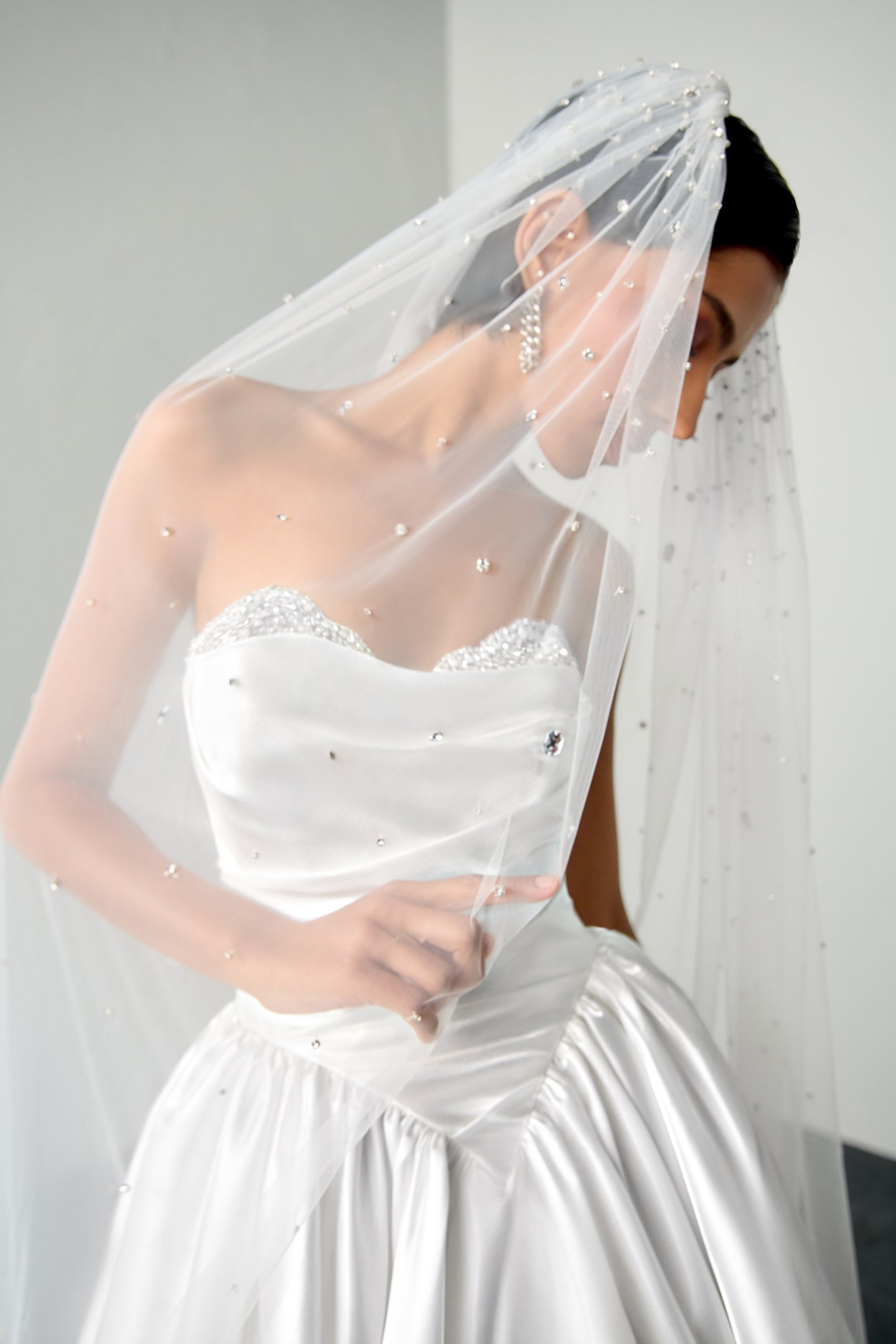 Justin Alexander Signature Style 99398 ECHO Liquid Satin Ball Gown with Crystal Peek-a-Boo Neckline