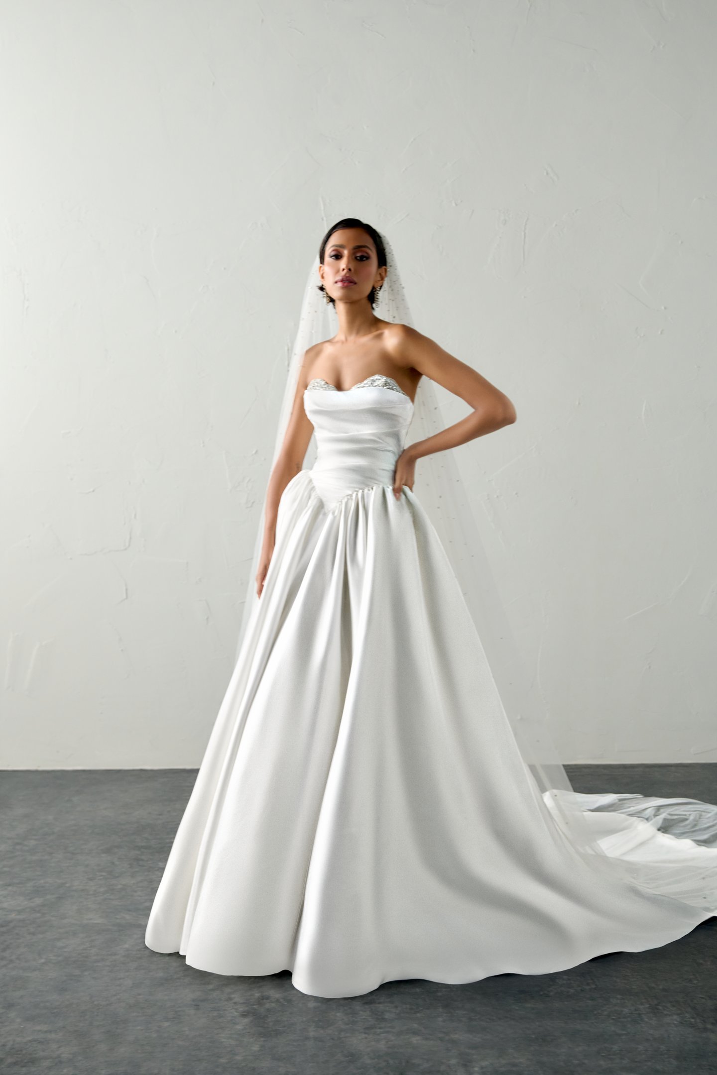 Justin Alexander Signature Style 99398 ECHO Liquid Satin Ball Gown with Crystal Peek-a-Boo Neckline