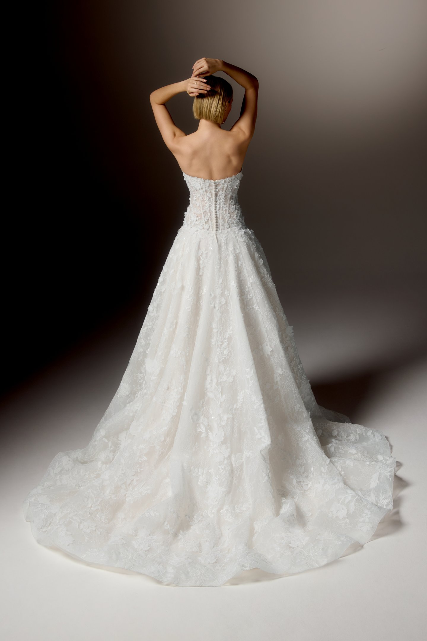 Justin Alexander Signature Style 99407 CARAVINA Allover Lace Dropped Waistline Ball Gown with Strapless Cat Eye Neckline and Matte Floral Appliqués and 3D Chiffon Florals