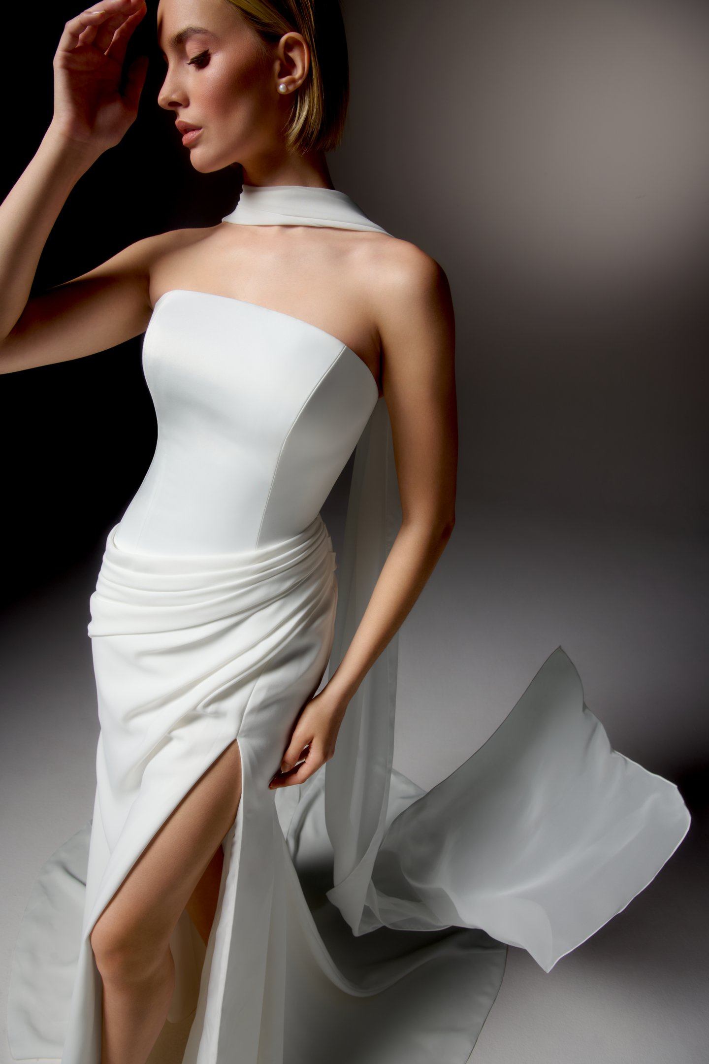 Justin Alexander Signature Style 99413 LUCIDA Clean Silky Crepe Fit and Flare Gown with Strapless Arched Neckline and Asymmetrical Waistline
