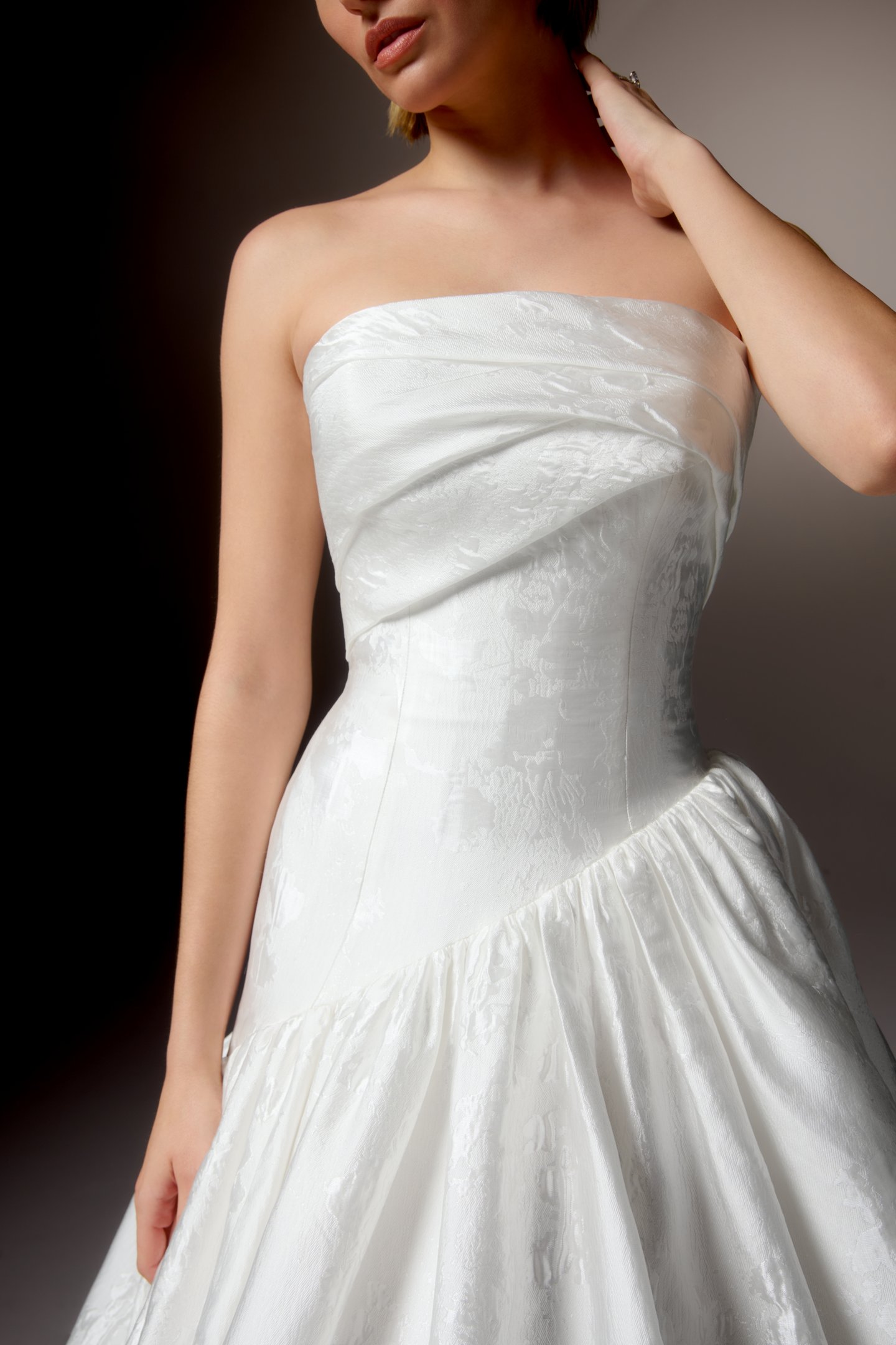 Justin Alexander Signature Style 99418 CARAVELLA Brocade Ball Gown with Strapless Cuff Neckline, Asymmetrical Waistline, and Dramatic Gathered Skirt