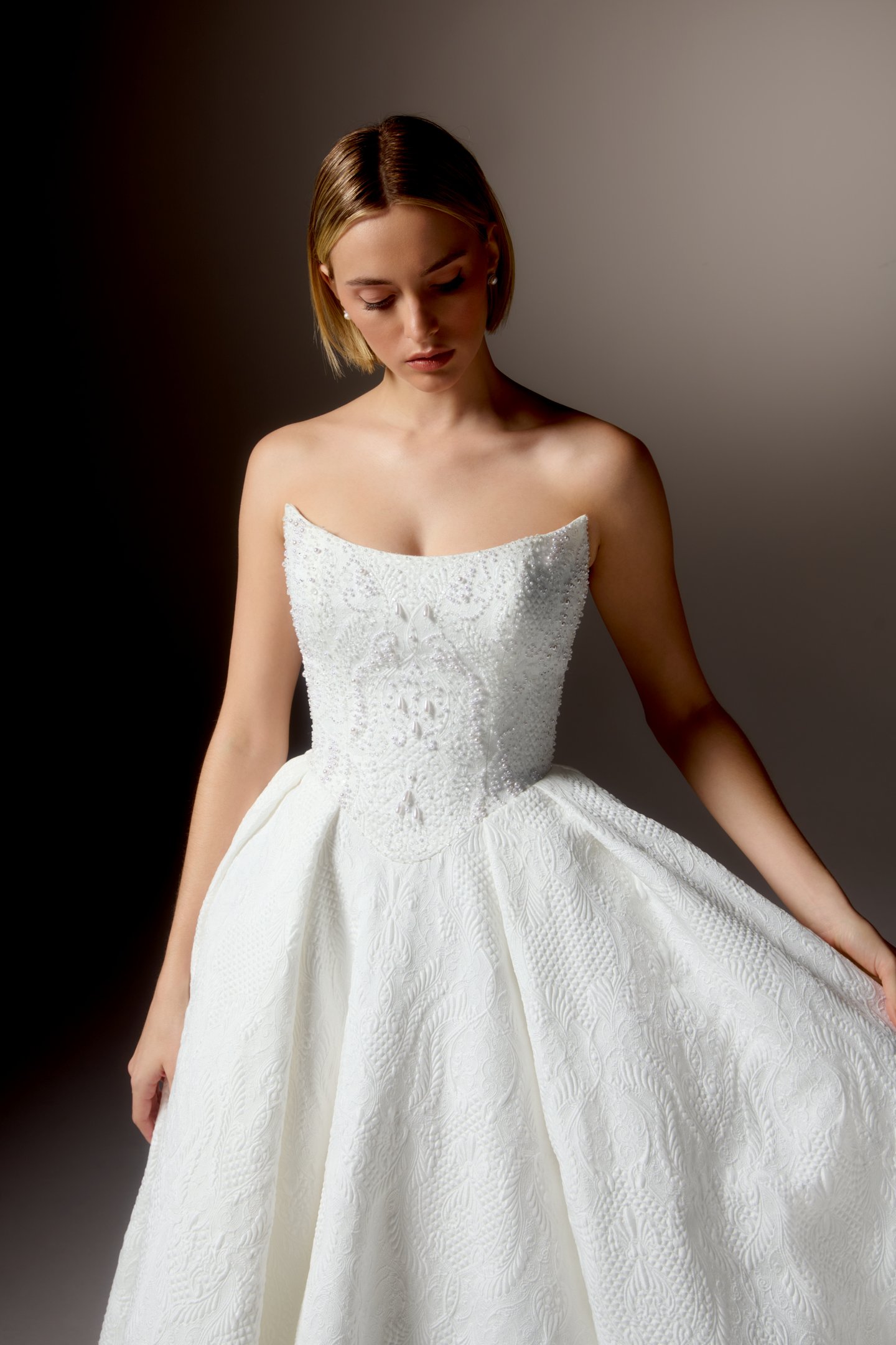 Justin Alexander Signature Style 99424 OMBRETTA Textured Brocade Ball Gown with Cat Eye Neckline, Beaded Bodice, and Basque Waistline