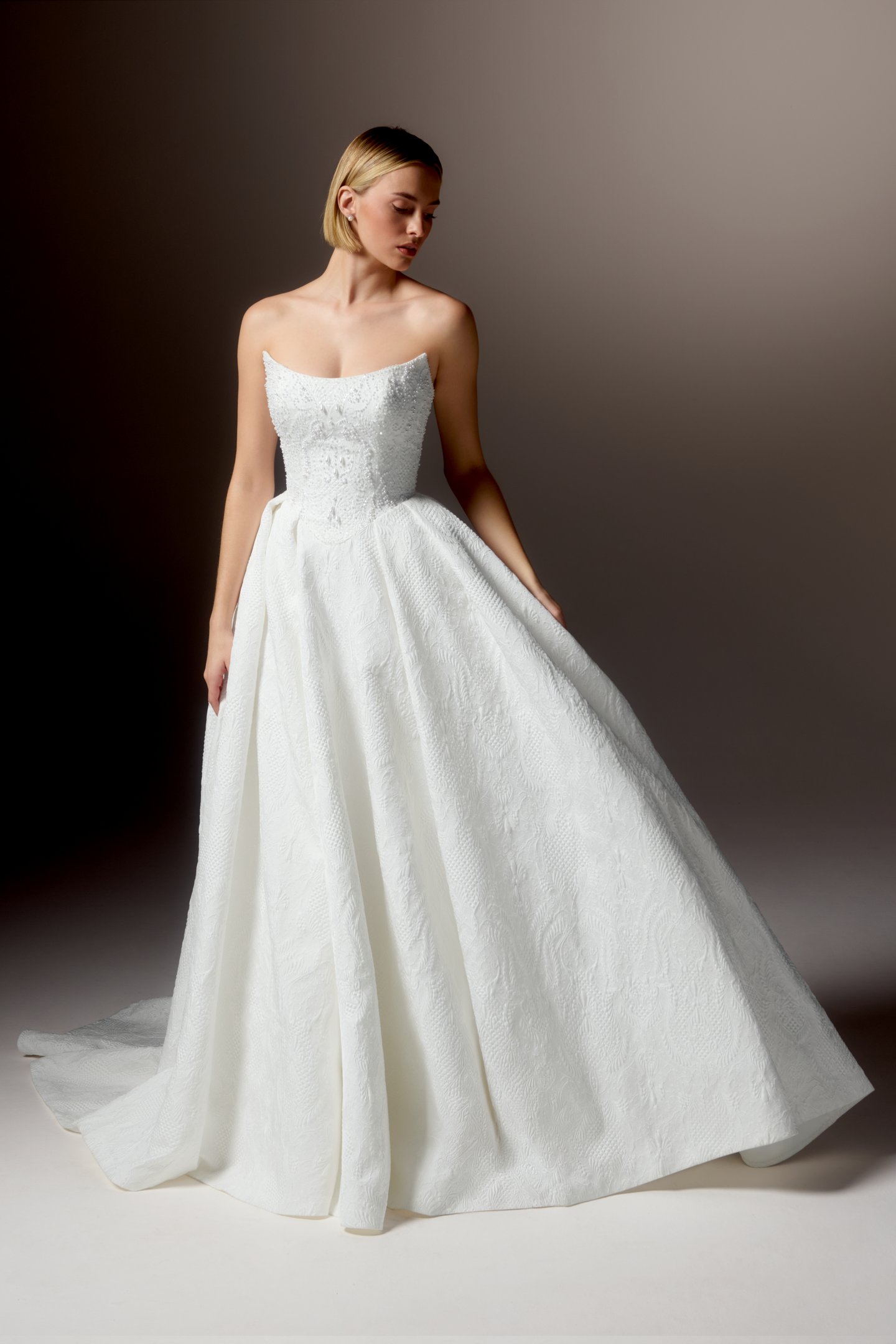 Justin Alexander Signature Style 99424 OMBRETTA Textured Brocade Ball Gown with Cat Eye Neckline, Beaded Bodice, and Basque Waistline