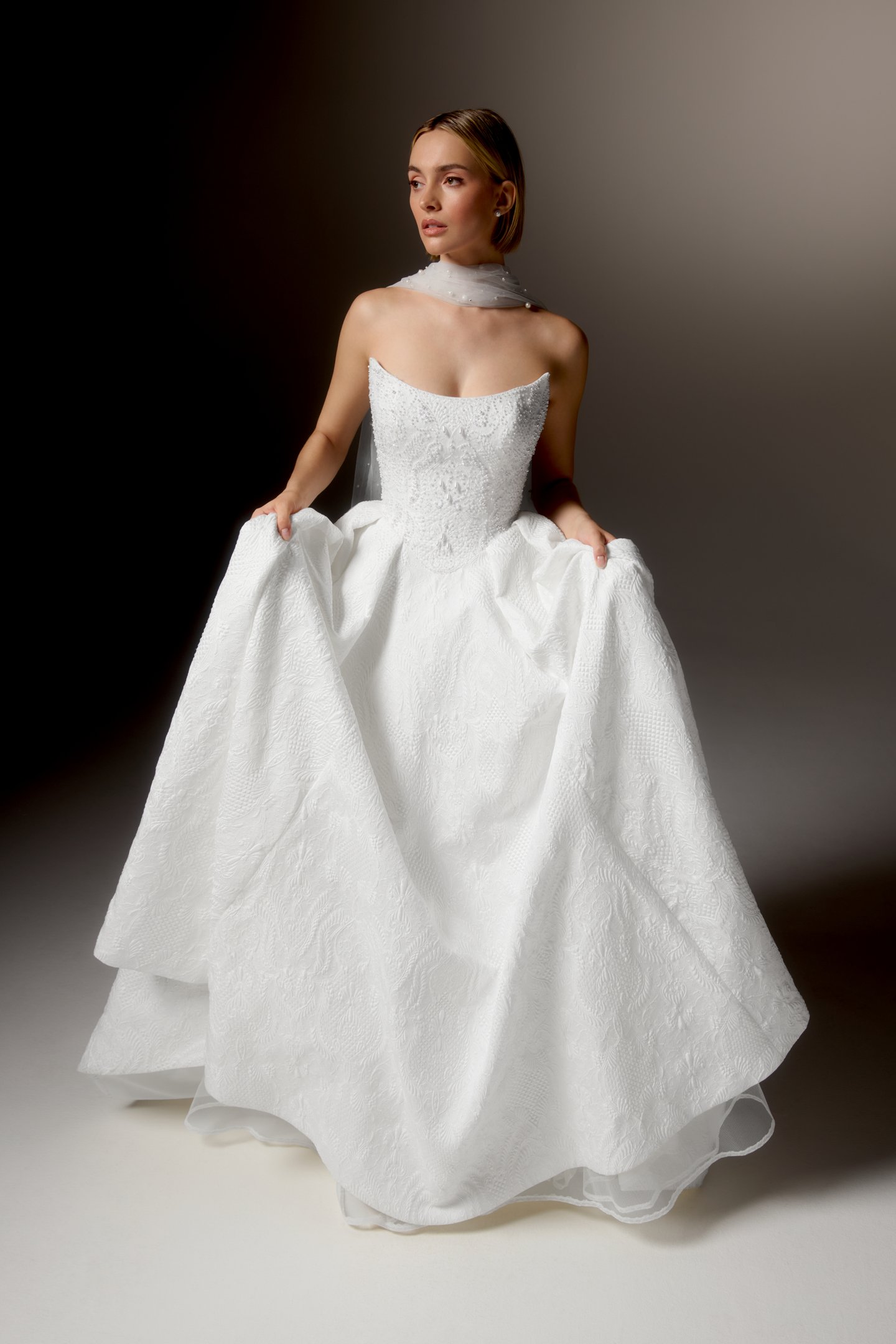 Justin Alexander Signature Style 99424 OMBRETTA Textured Brocade Ball Gown with Cat Eye Neckline, Beaded Bodice, and Basque Waistline