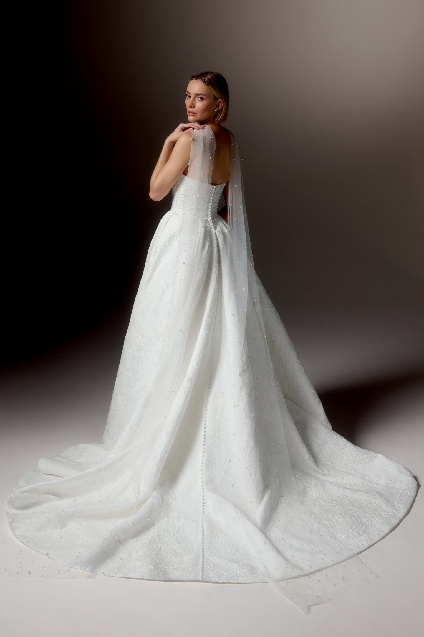 Justin Alexander Signature Style 99424 OMBRETTA Textured Brocade Ball Gown with Cat Eye Neckline, Beaded Bodice, and Basque Waistline