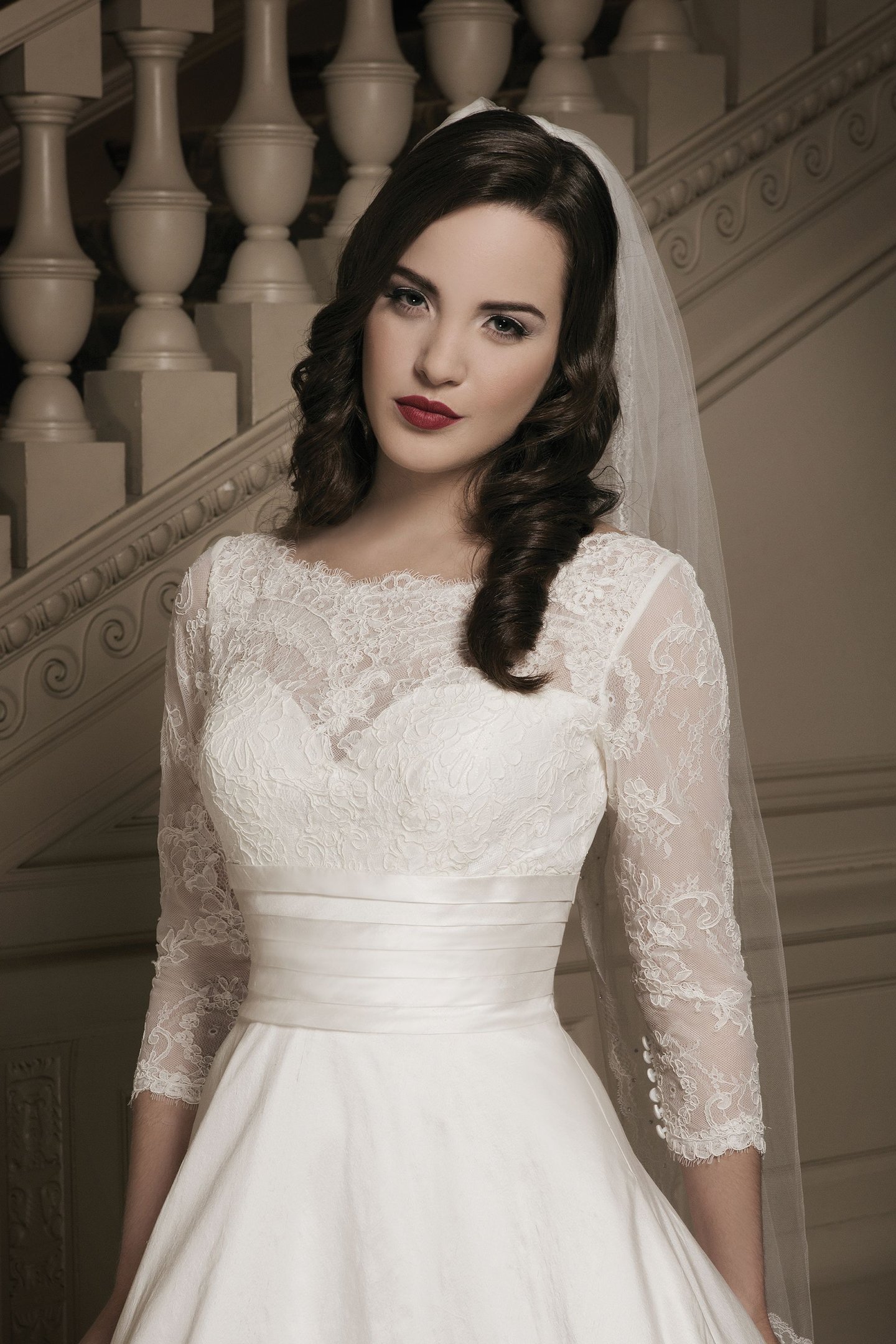 Justin Alexander Style 8695 Lace ball gown adorned by a Sabrina neckline
