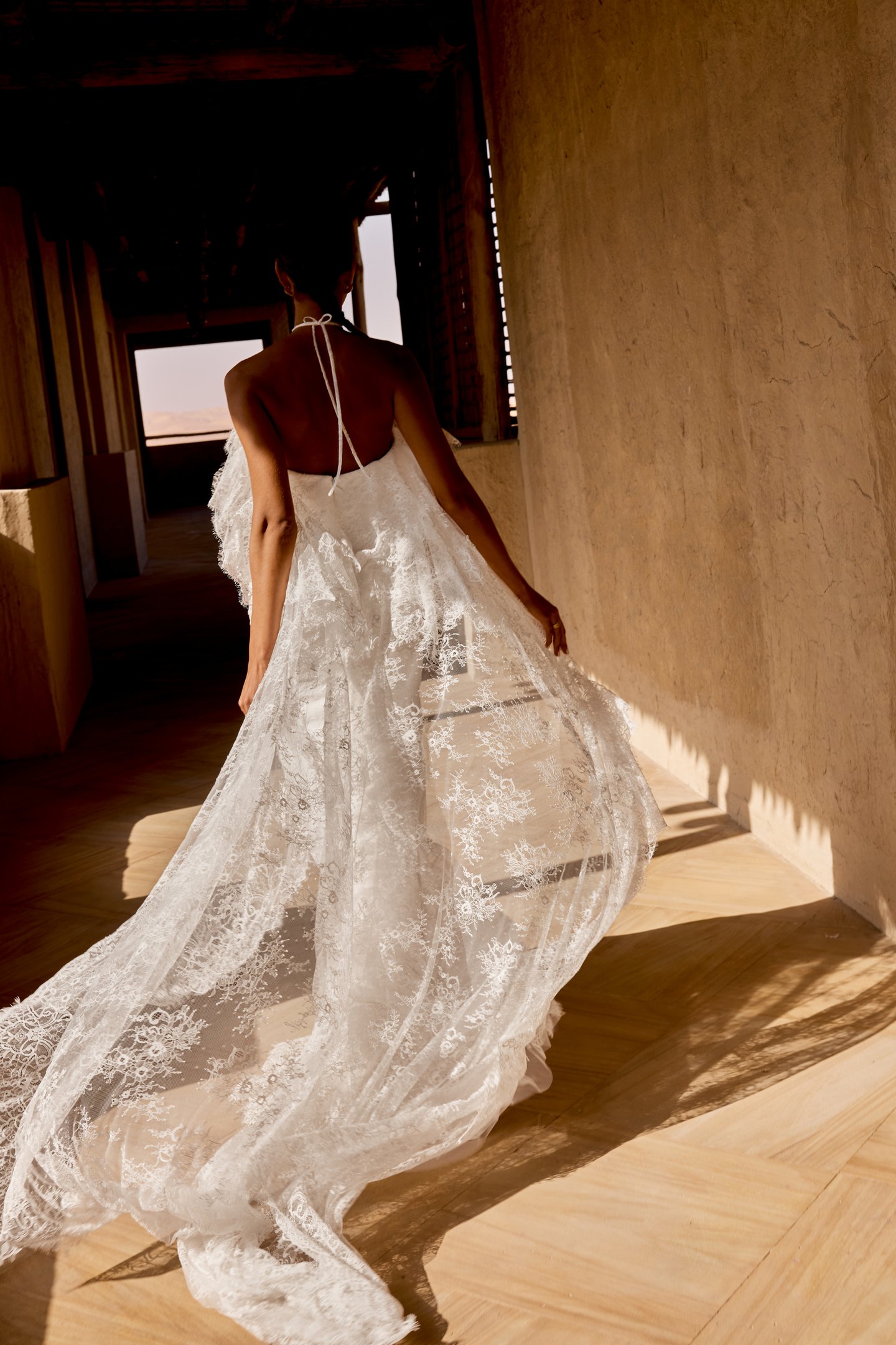 Lillian West Style 66496 Allover Lace Fit and Flare Gown with Halter Neckline and Tiered Ruffled Cape Cascading into Chapel Length Train