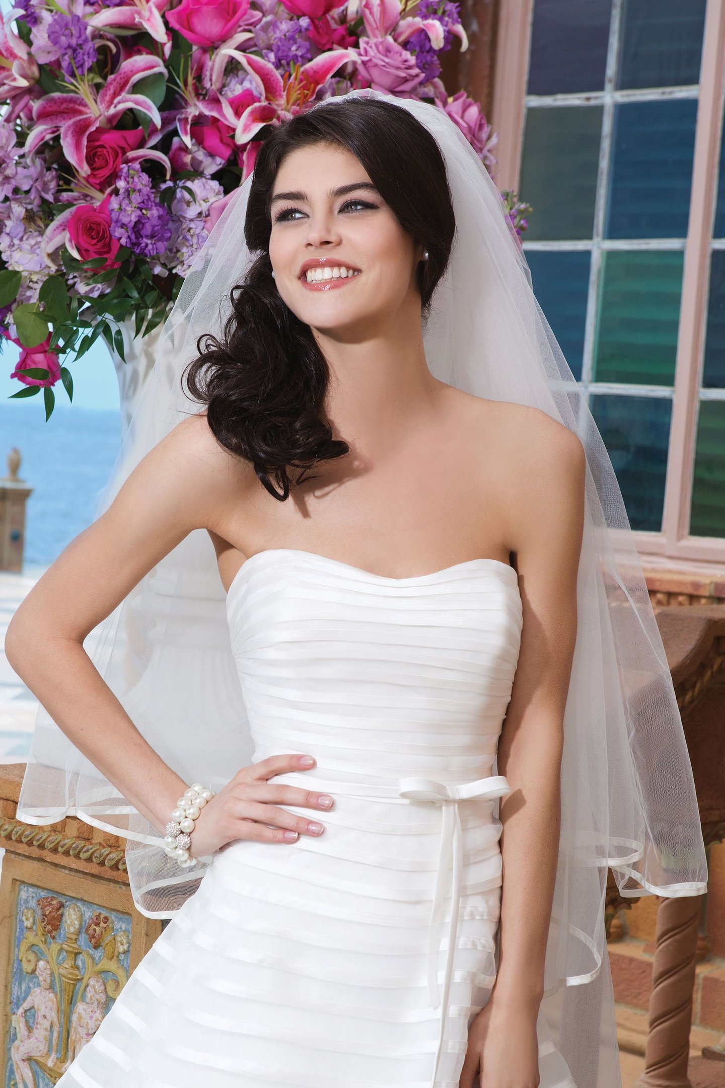 Sincerity Bridal Style 3849 Organza; matte satin A-line dress adorned by a strapless neckline