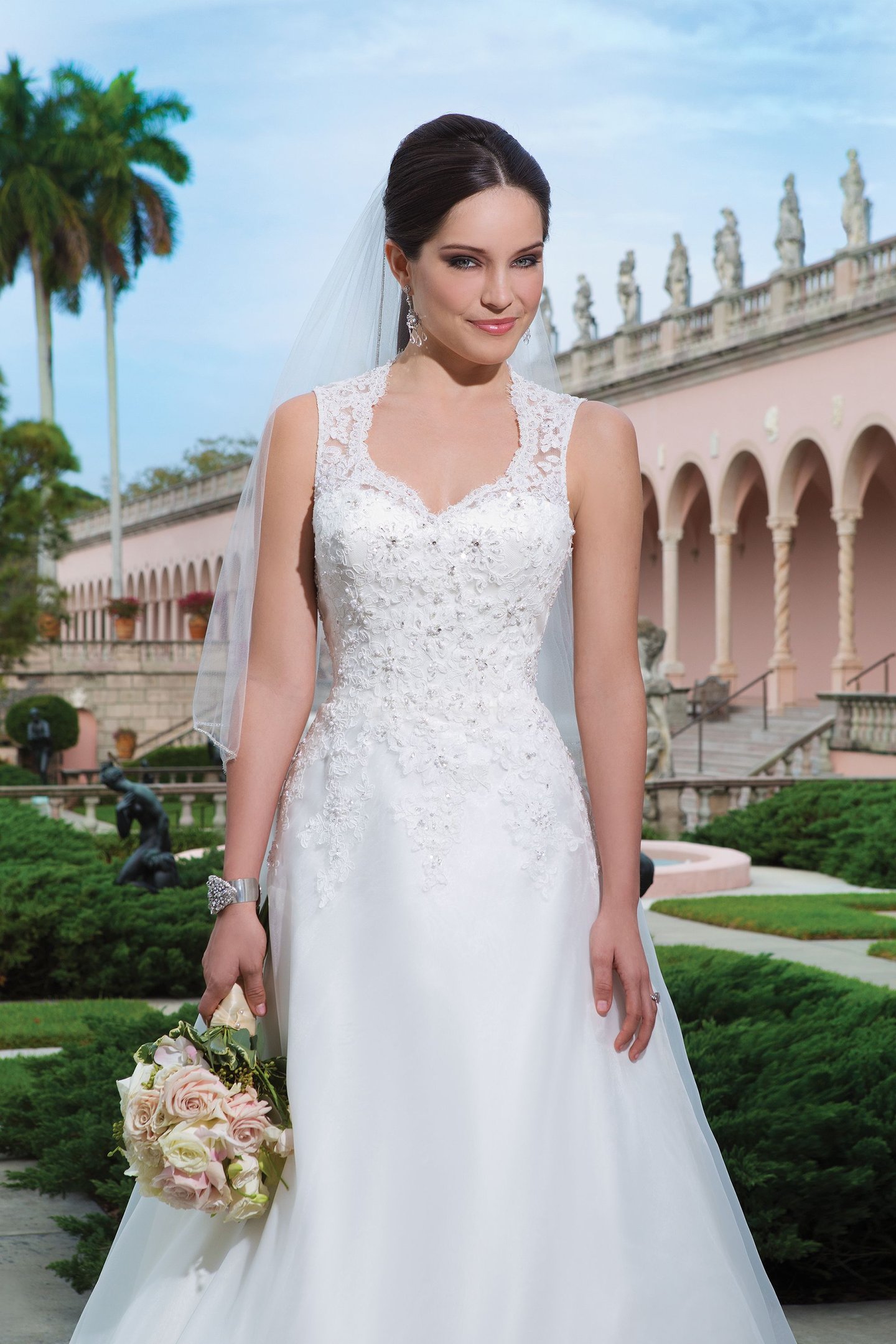 Sweetheart Gowns Style 6066 Organza, beaded alencon lace A-line dress embellished by a Queen Anne neckline