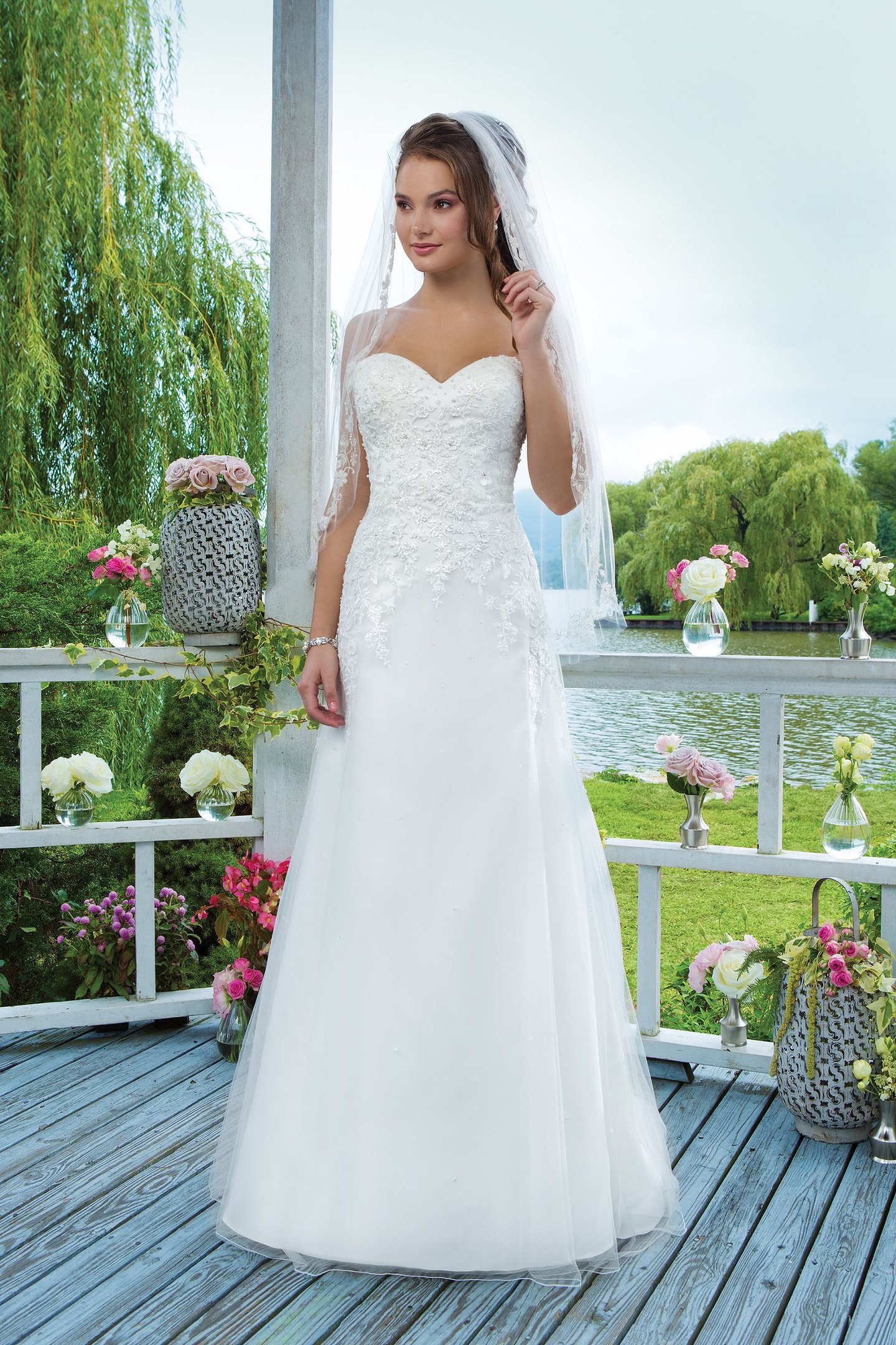 Sweetheart Gowns Style 6096 Beaded emboridered lace and tulle Slim A-line accentuated by a sweetheart neckline.