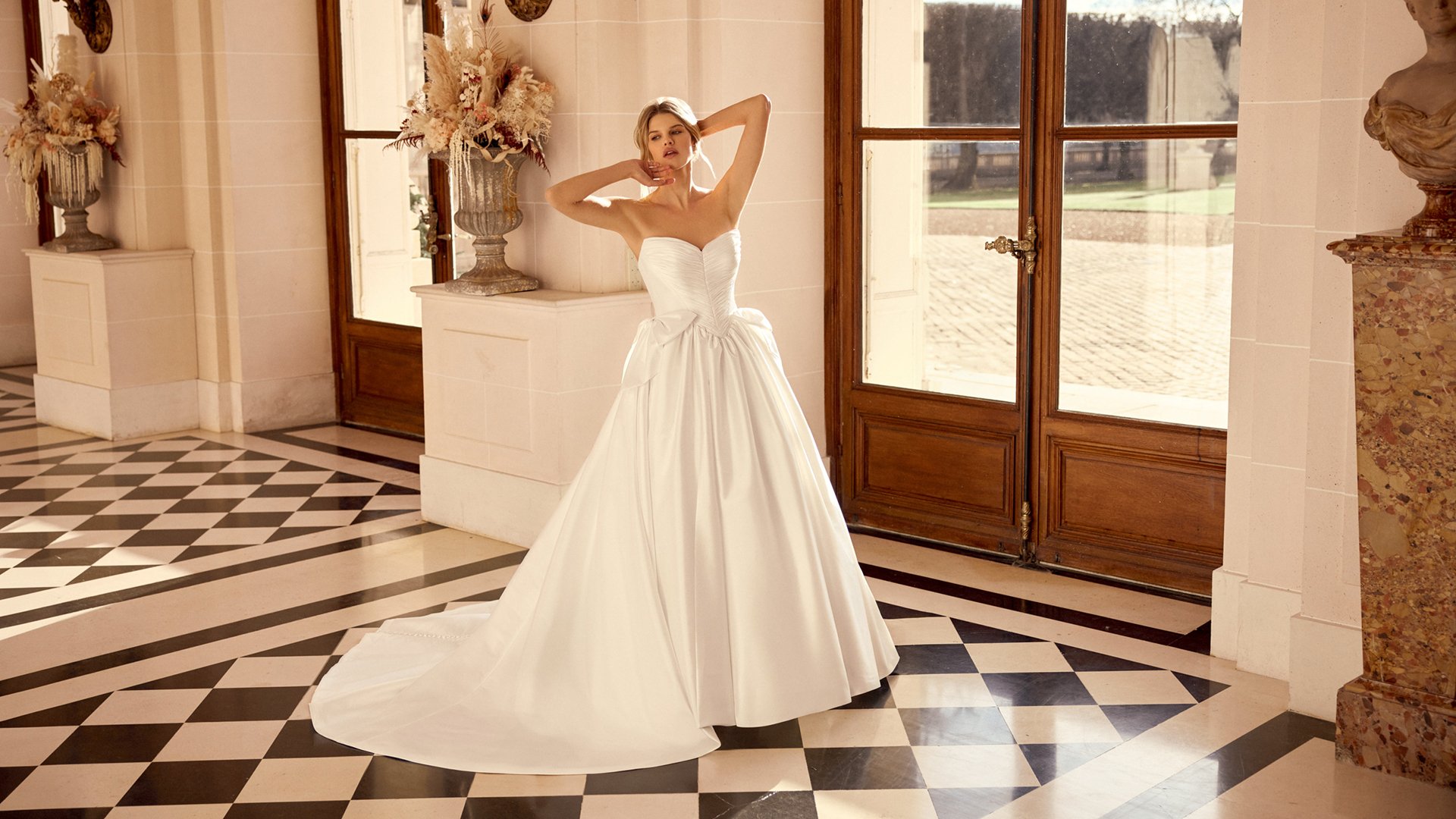 Justin Alexander Style 88545 Naomi Taffeta Ball Gown with Tightly Pleated Bodice and Gathered Skirt with Bow Accents