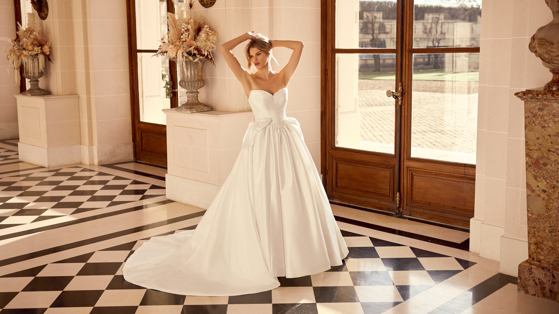 Justin Alexander Style 88545 Naomi Taffeta Ball Gown with Tightly Pleated Bodice and Gathered Skirt with Bow Accents