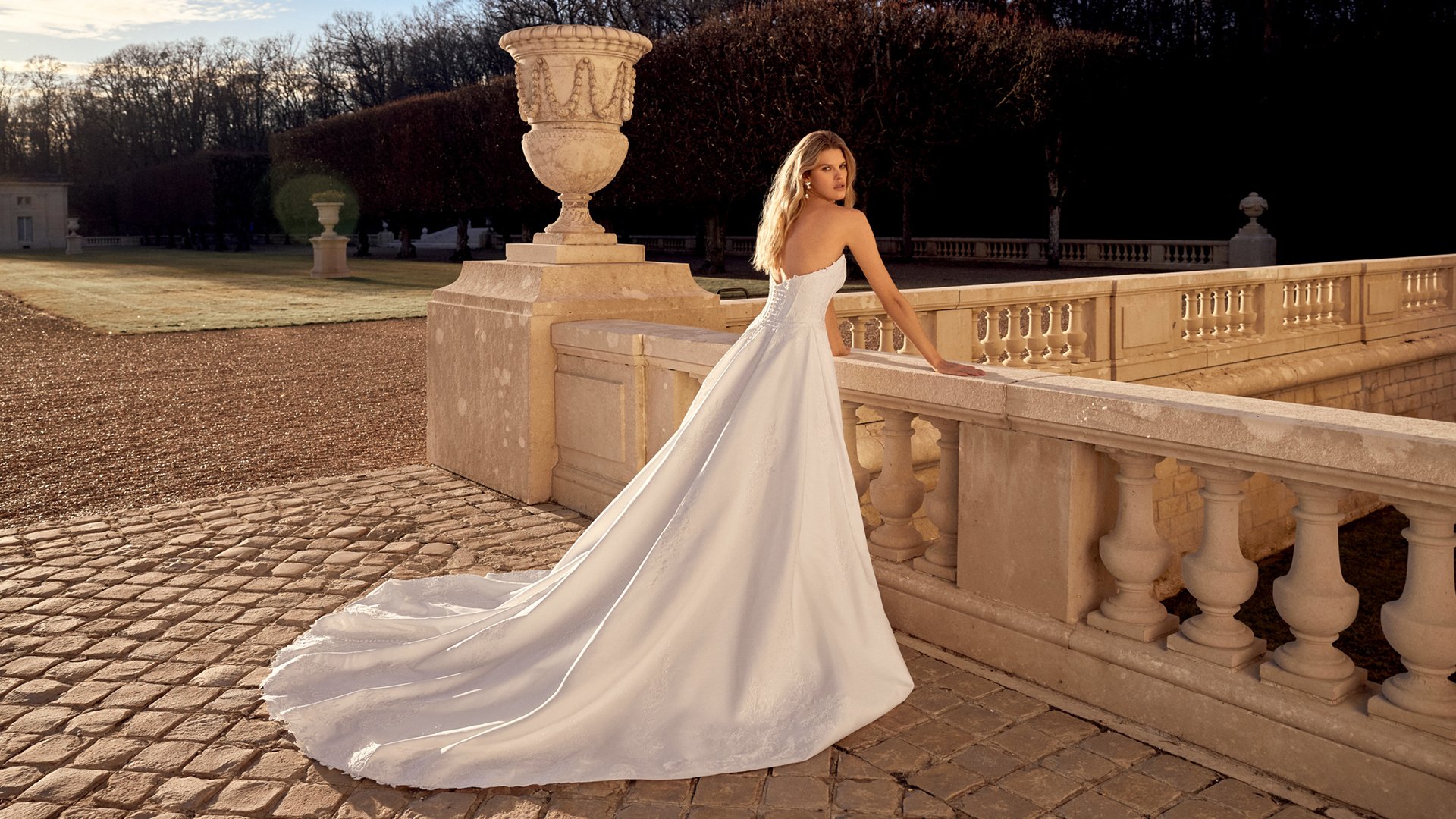 Justin Alexander Style 88551 Nolan Satin Ball Gown with Cat Eye Neckline, Corset Bodice, and Exposed Boning