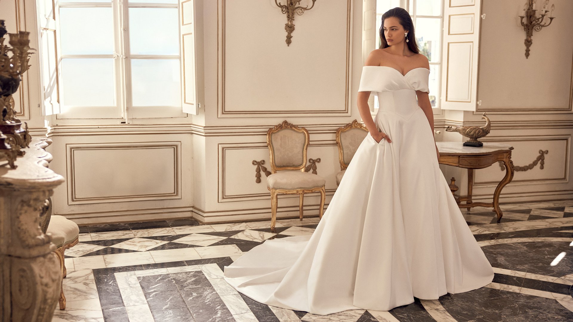 Justin Alexander Style 88552 Naima Mikado A-Line Gown with Off-the-Shoulder Portrait Neckline and Basque Waist