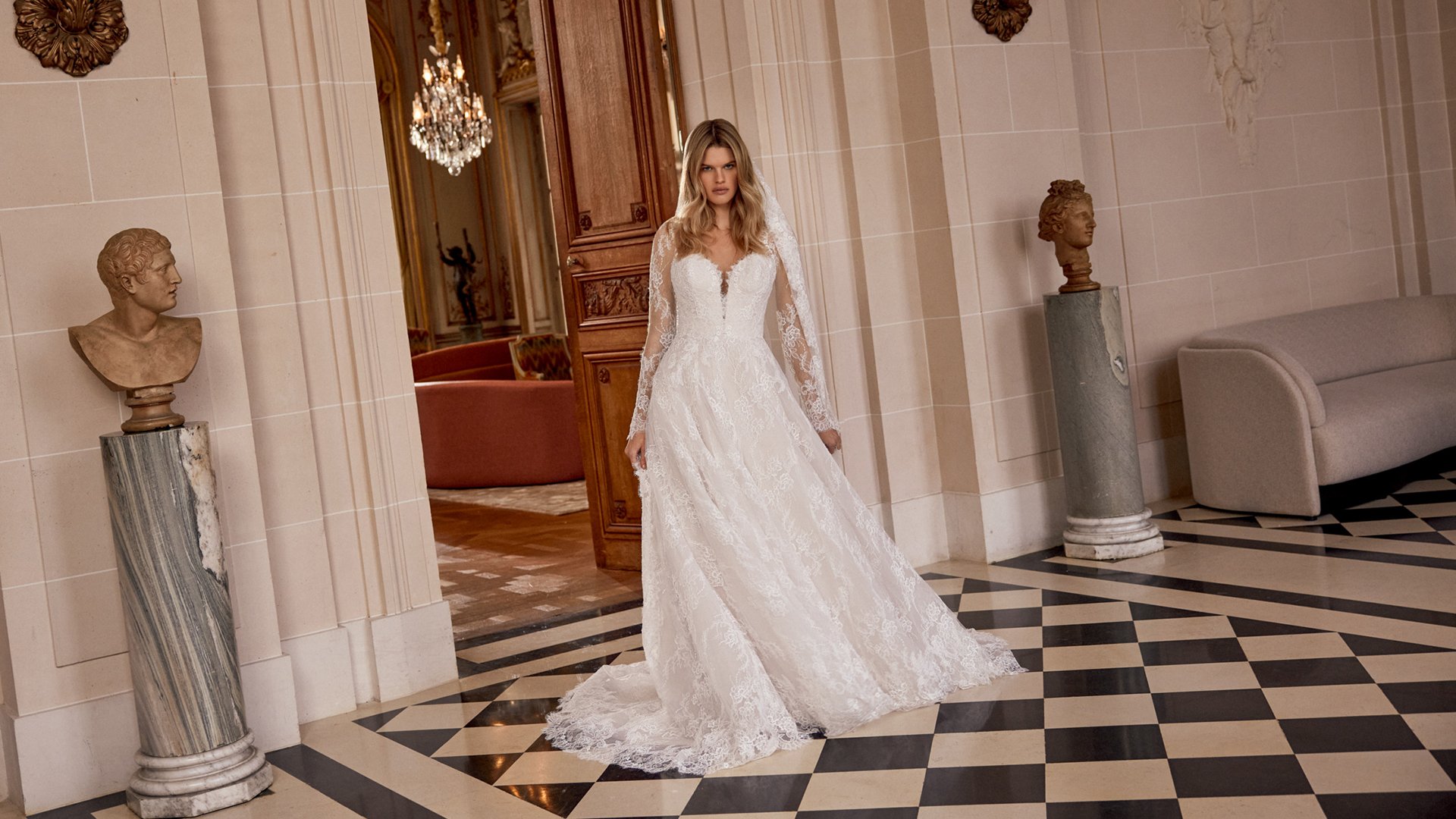Justin Alexander Style 88557 Nela Allover Alençon Corded Lace A-Line Gown with Plunging Queen Anne Neckline and Illusion Keyhole Back