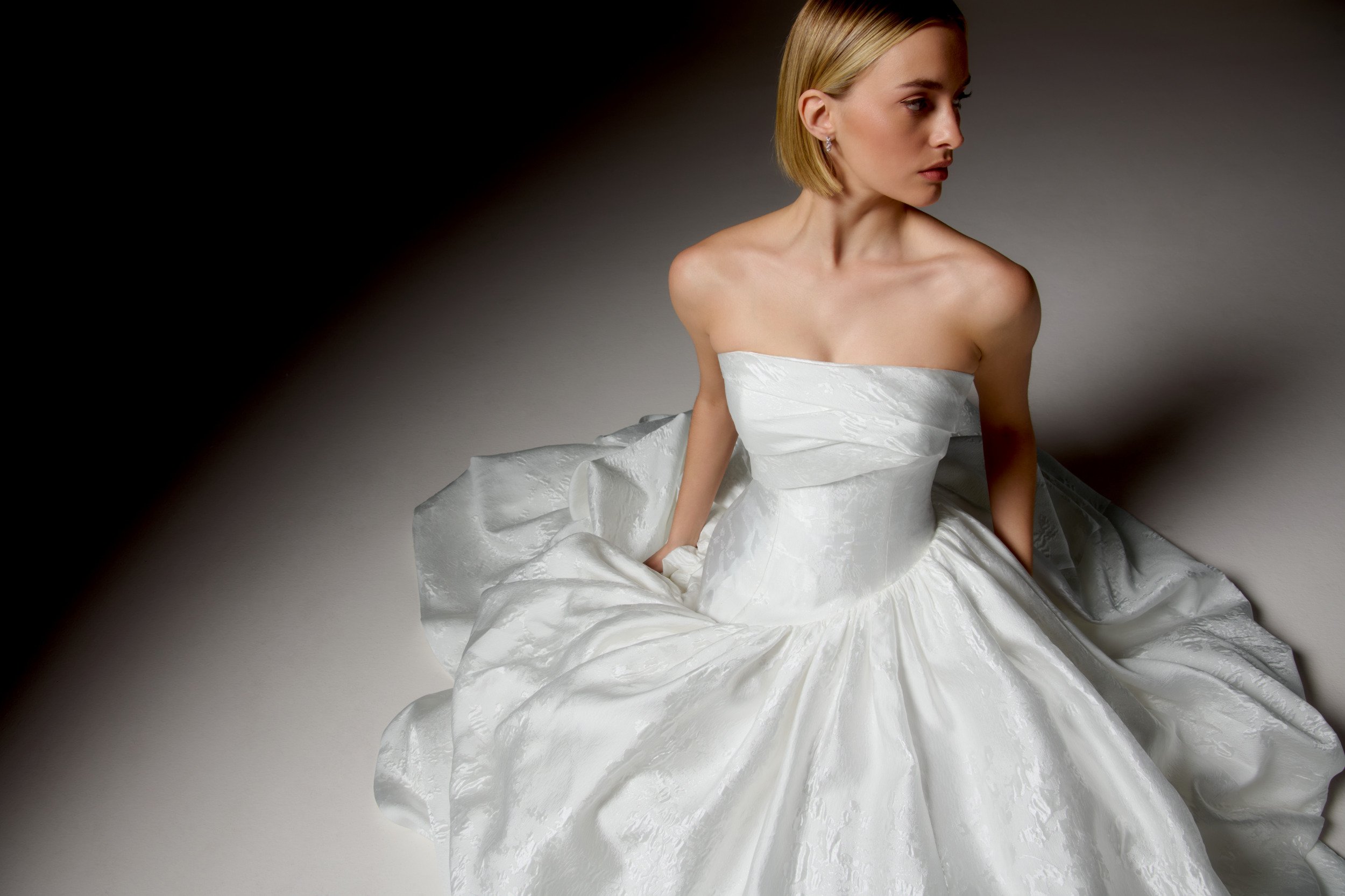 Justin Alexander Signature Style 99418 CARAVELLA Brocade Ball Gown with Strapless Cuff Neckline, Asymmetrical Waistline, and Dramatic Gathered Skirt