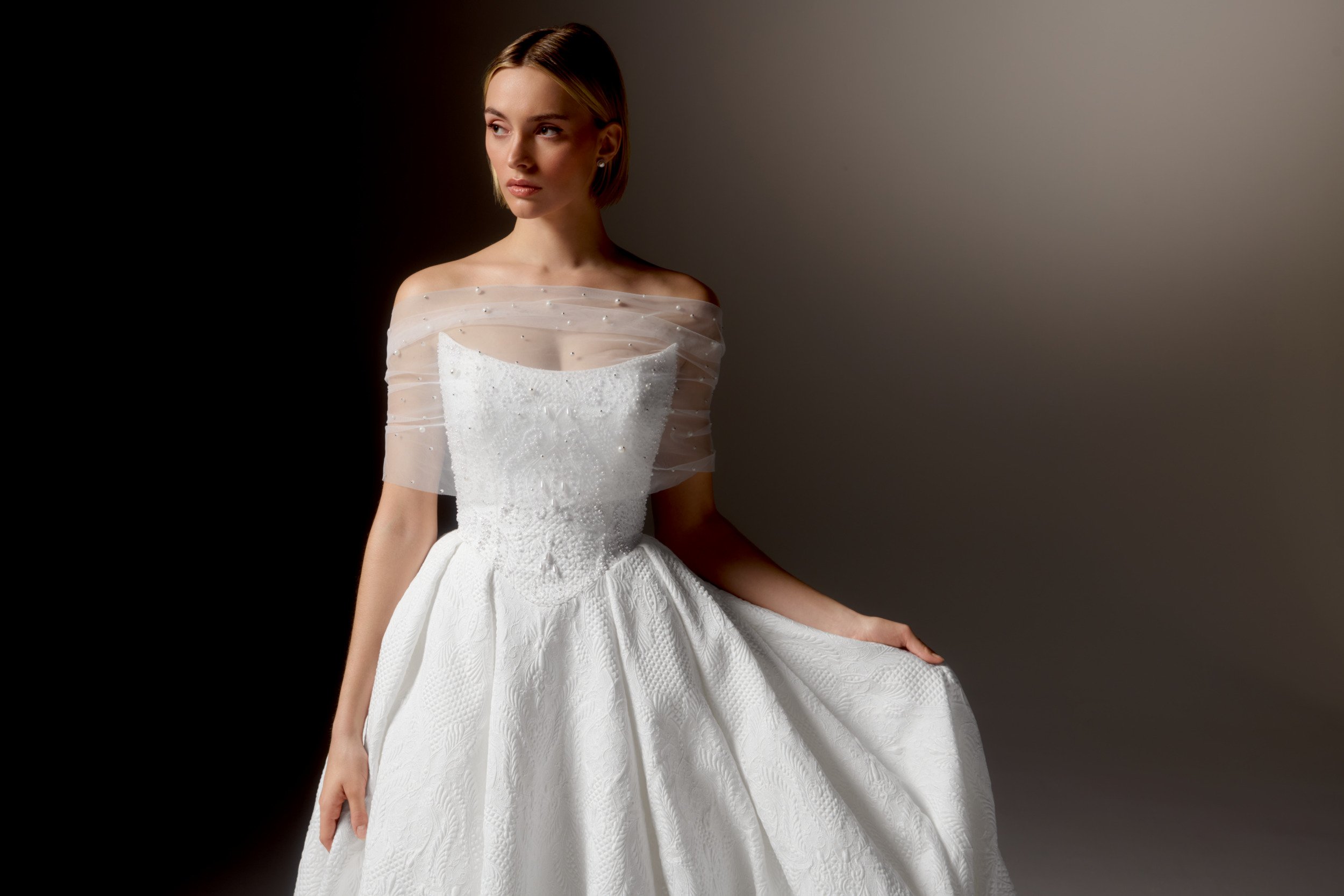 Justin Alexander Signature Style 99424 OMBRETTA Textured Brocade Ball Gown with Cat Eye Neckline, Beaded Bodice, and Basque Waistline