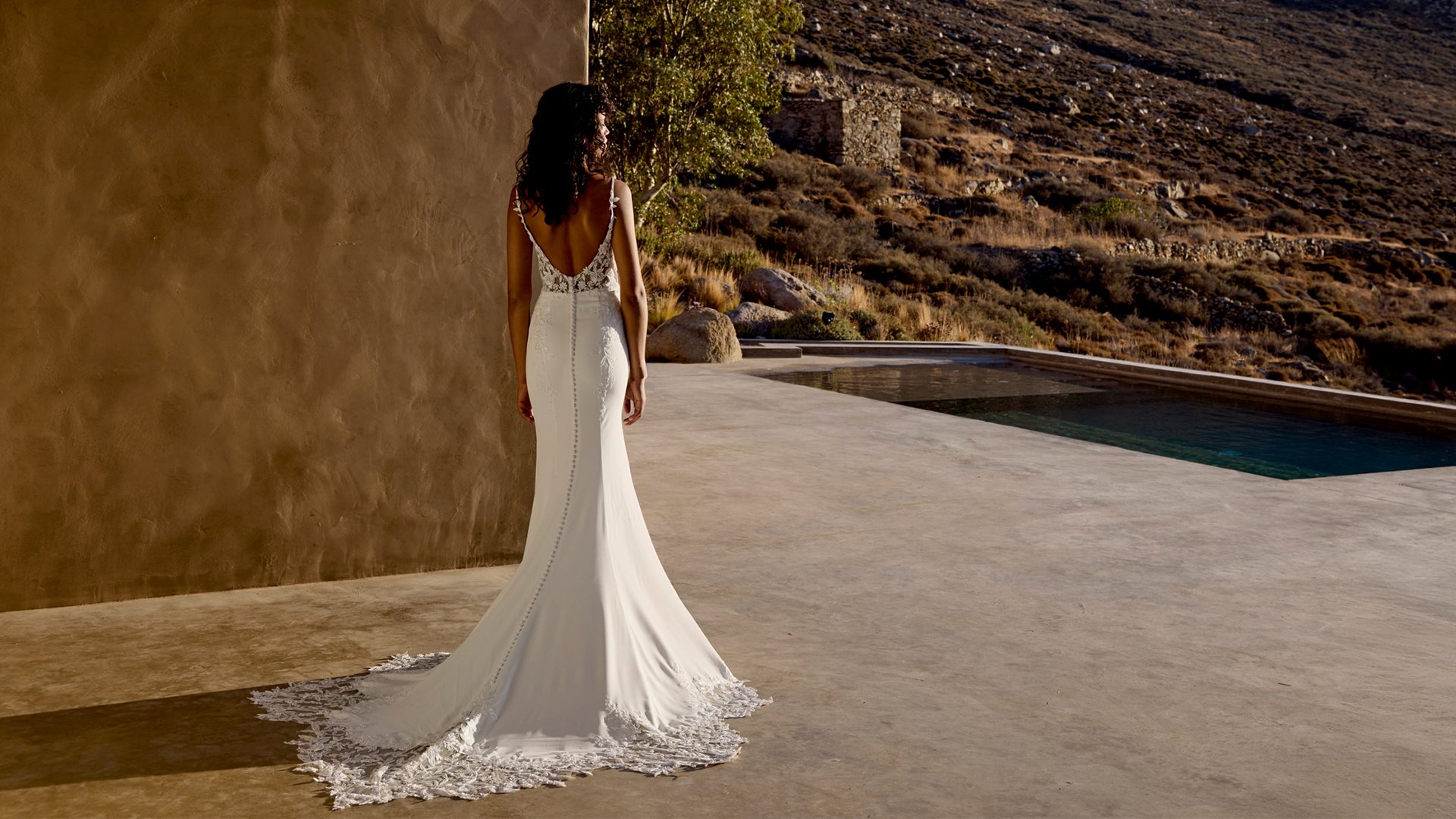 Lillian West Style 66447 Crepe Fit & Flare Gown with Draped Bikini Neckline and Lace Appliqués