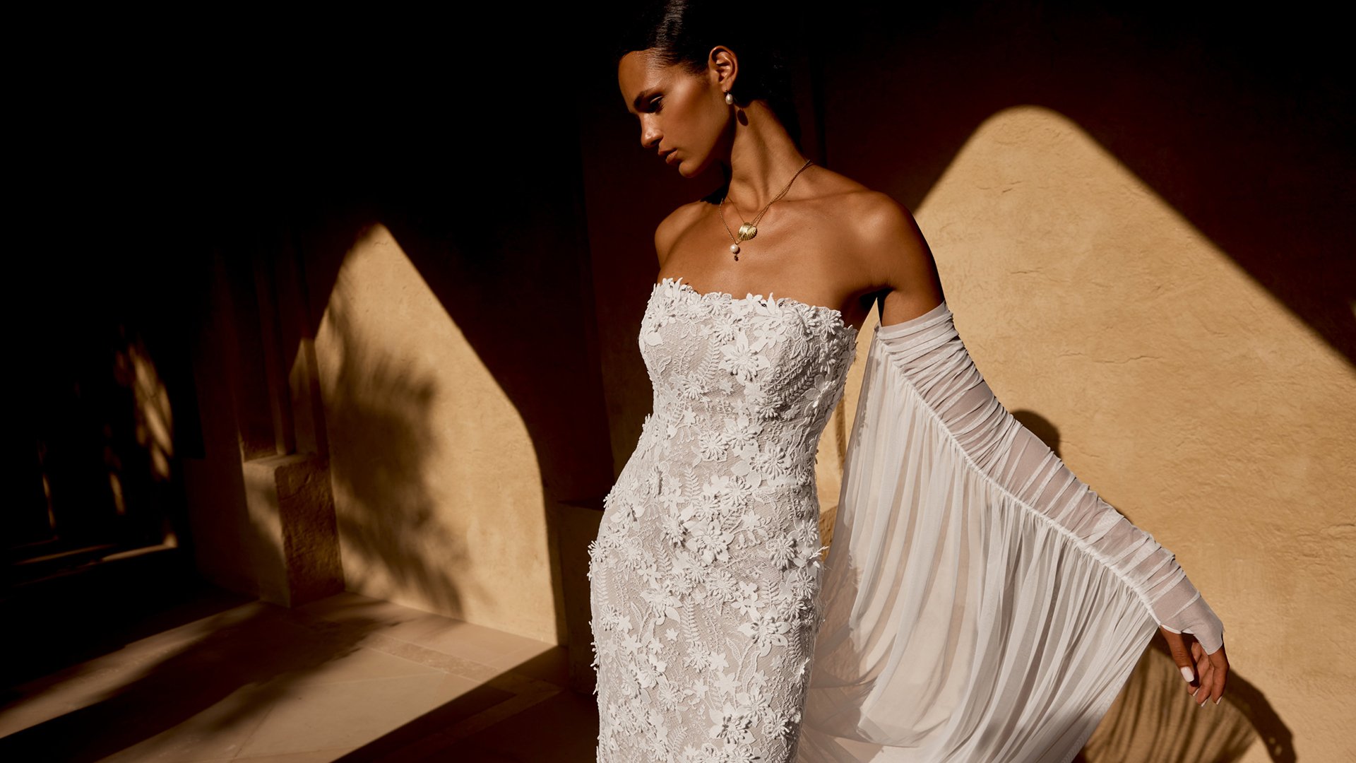 Lillian West Style 66486 Allover Embroidered Lace Fit and Flare Bridal Gown with Strapless Straight Neckline and 3D Floral Lace Appliqués
