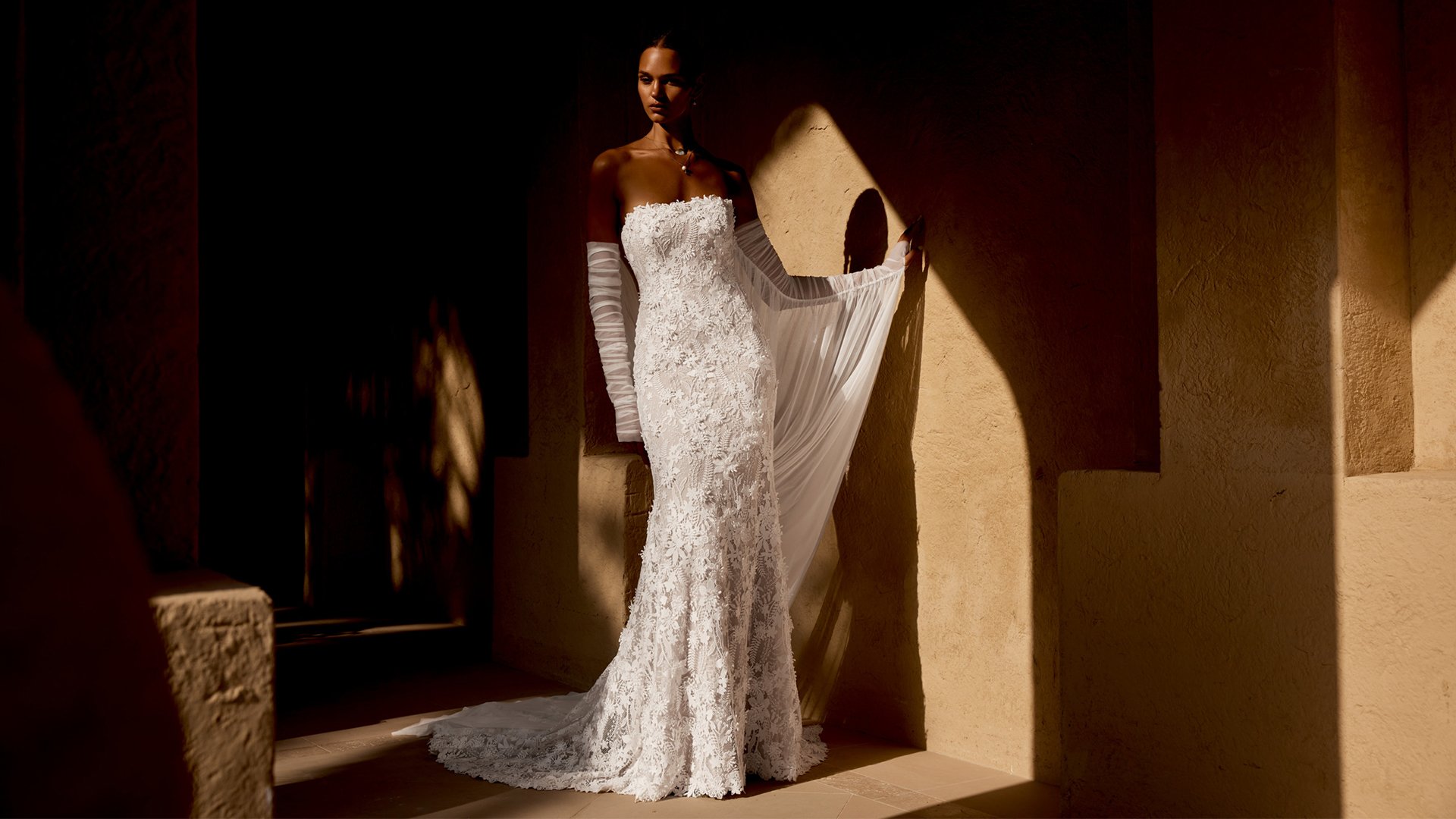 Lillian West Style 66486 Allover Embroidered Lace Fit and Flare Bridal Gown with Strapless Straight Neckline and 3D Floral Lace Appliqués