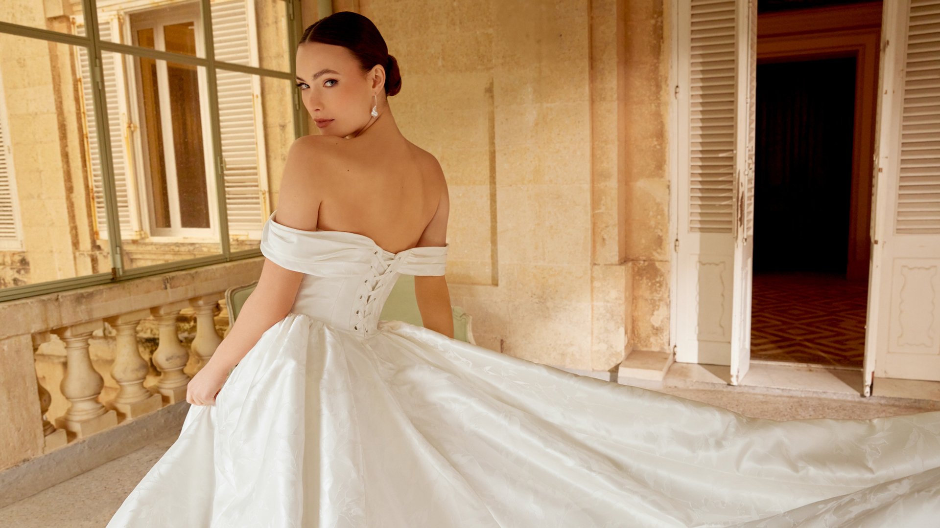 Sincerity Bridal Style 44601 Off-the-Shoulder Floral Brocade A-Line gown with Off-the-Shoulder Neckline and Princess Seams
